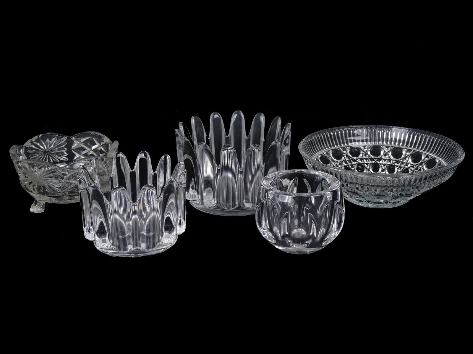 MID CENTURY GLASS AND CRYSTAL CANDY BOWLS ETC.: A collection of five vintage cut glass and crystal tableware pieces. Includes a mid century modern DANSK crystal candle holder with a branded label on the bottom, a large round crystal glass fruit bow