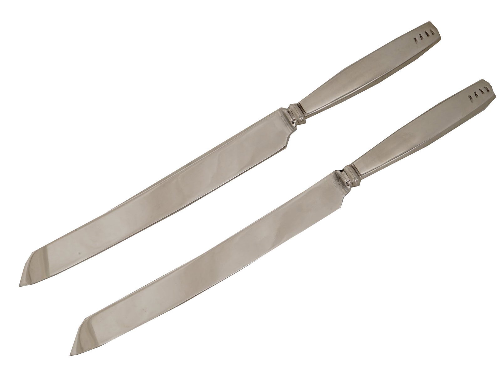 TWO LISA JENKS NOTCH LUNT STAINLESS STEEL KNIVES: A pair of Lunt stainless steel knifes, the notch pattern. Designed by Lisa Jenks. Both marked. Made in Korea. Modern Kitchenware And Flatware For Collectors. Dimensions: L: 12 1/2 in. All measurements