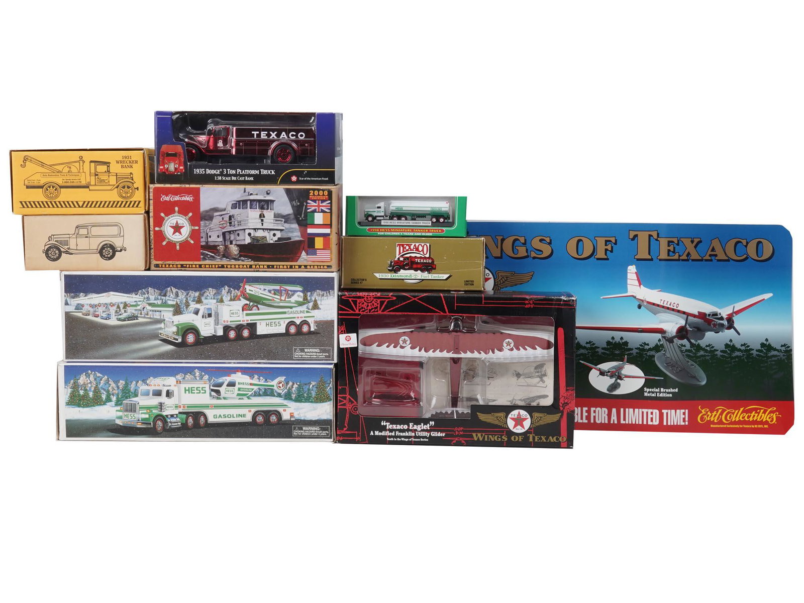 TOY CARS WINGS OF TEXACO HESS TRUCKS IOB 10 ITEMS: Vintage American toy cars in original box, a total of 10 items. Wings of Texaco: 1935 Dodge 3 Ton Platform Truck, Texaco Eaglet with a Modified Franklin Utility Gilder, 1930 Diamond Fuel Tanker, Fire 