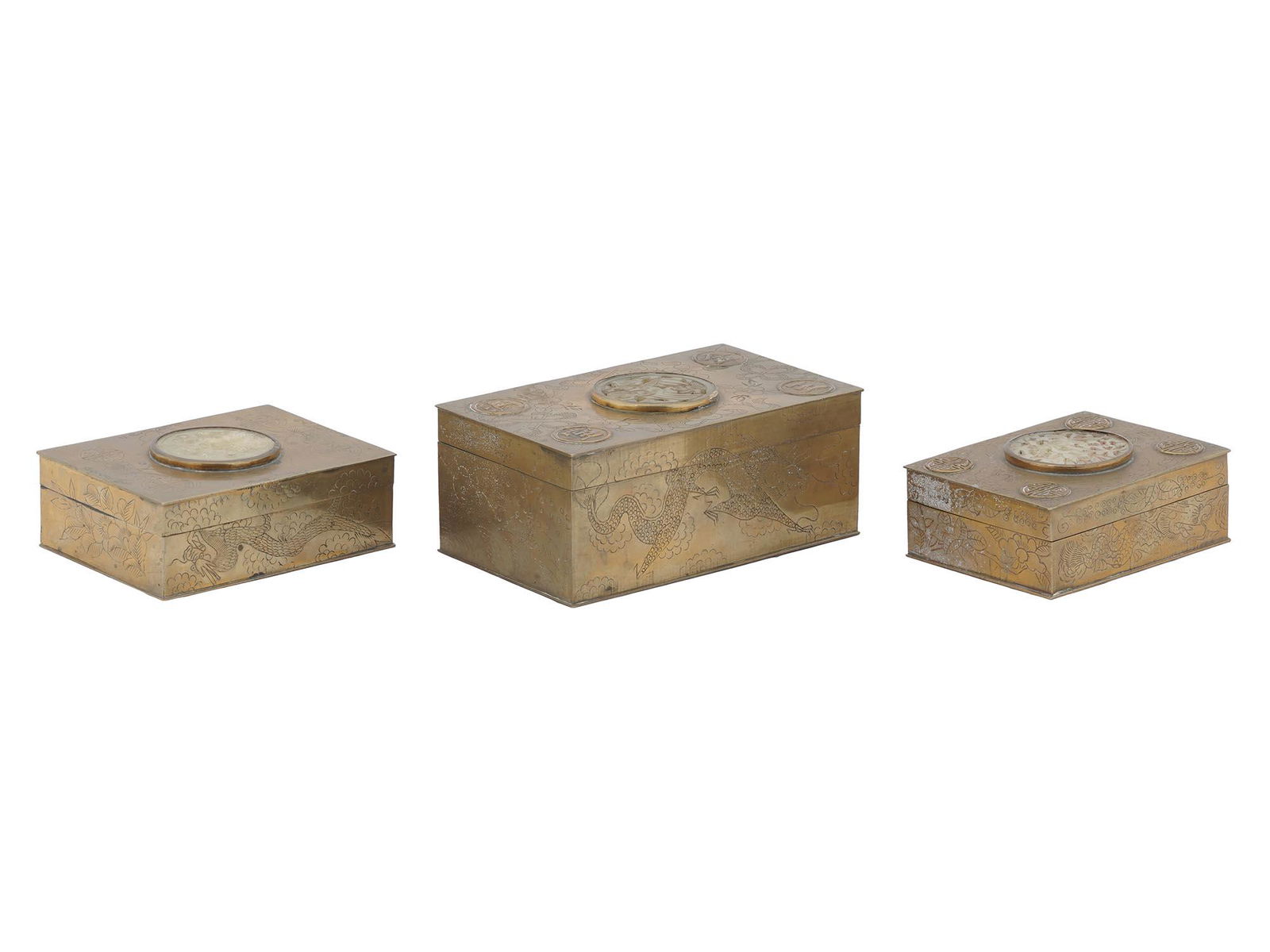 CHINESE CARVED BRASS SOAP STONE THREE BOXES SET: A set of three Chinese hand carved wood, brass and soap stone boxes in various sizes. Each box is adorned with relief stamps with Hieroglyphs and a hand carved soap stone medallion on the top of the l