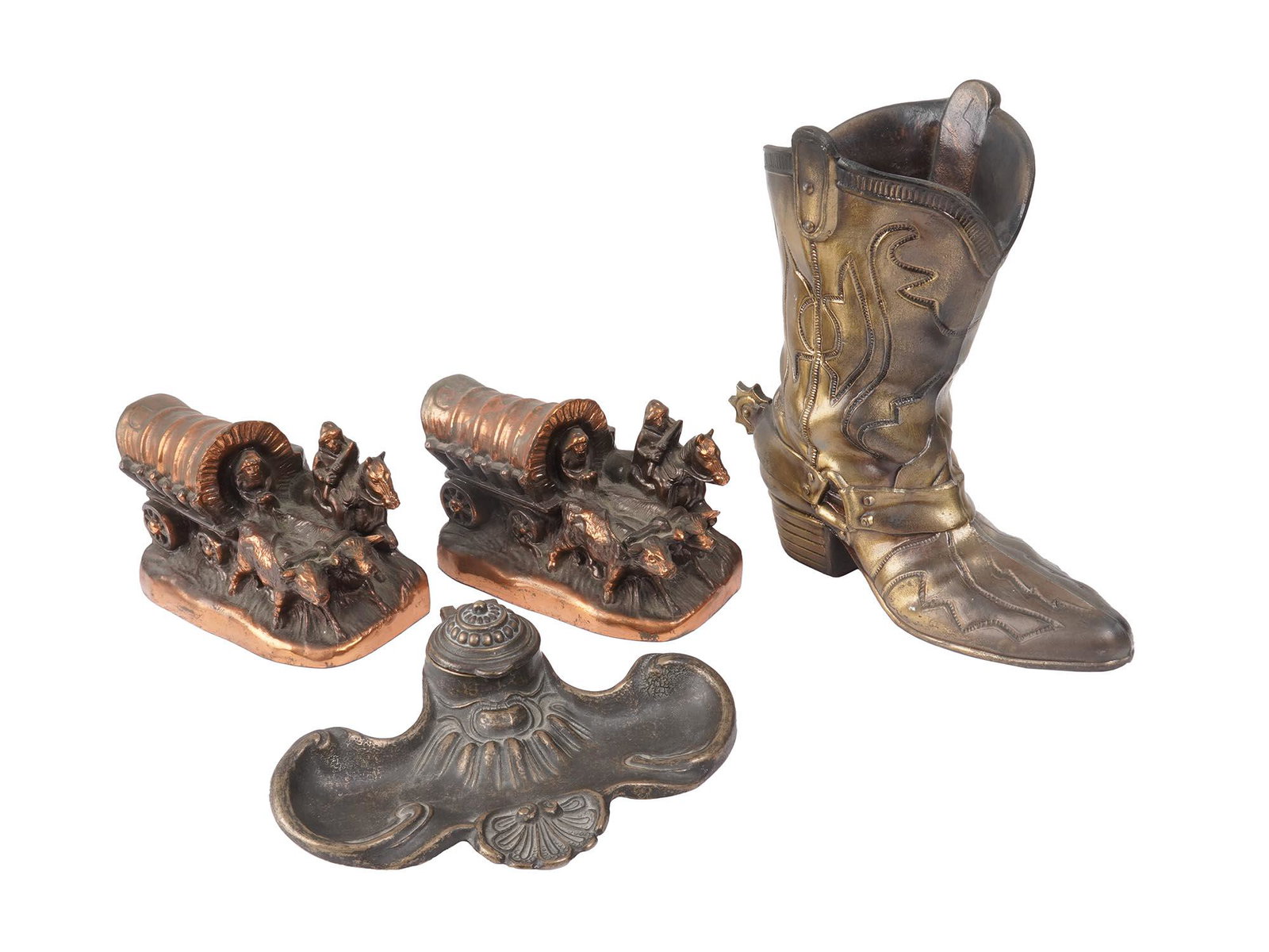COLLECTION VINTAGE ANTIQUE METAL HOME DECOR ITEMS: The collection includes a brass toned cast metal cowboy boot with a spur planter marked and copyright by ArtBrass Giftmakers; a pair of figural cooper book ends in the shape of oxen wagon with a cab, 