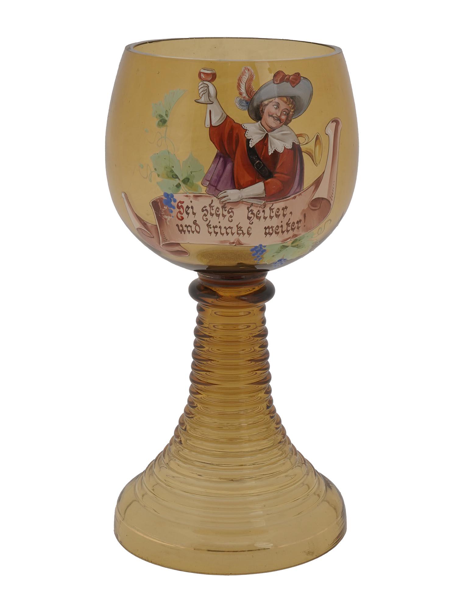 VINTAGE GERMAN GLASS ROMER BACCHUS LARGE WINE GOBLET: A vintage German crystal footed Romer Bacchus wine goblet decorated with a hand painted image of a drinking man and the inscription in German. Circa the 1960s. Usually used to serve sweet wines from t