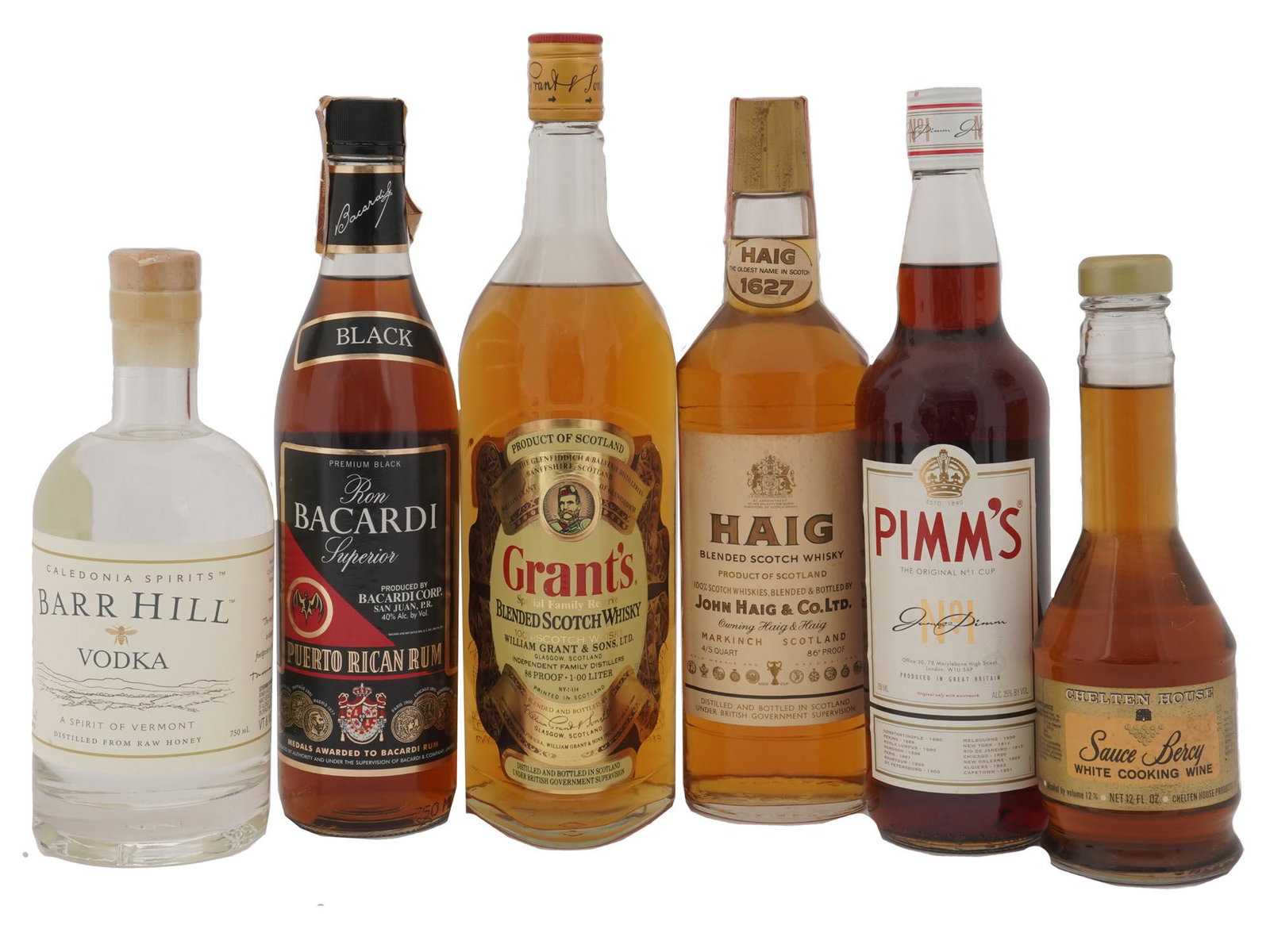 SIX VINTAGE ALCOHOL BOTTLES SCOTCH WHISKY SPIRITS: A set of six vintage sealed alcohol bottles. Pimm's Original No.1 Gin Cup. John Haig & Co. Ltd., Haig Blended Scotch Whisky. Caledonia Spirits, Barr Hill Vodka, A Spirit of Vermont. Ron Bacardi Superi