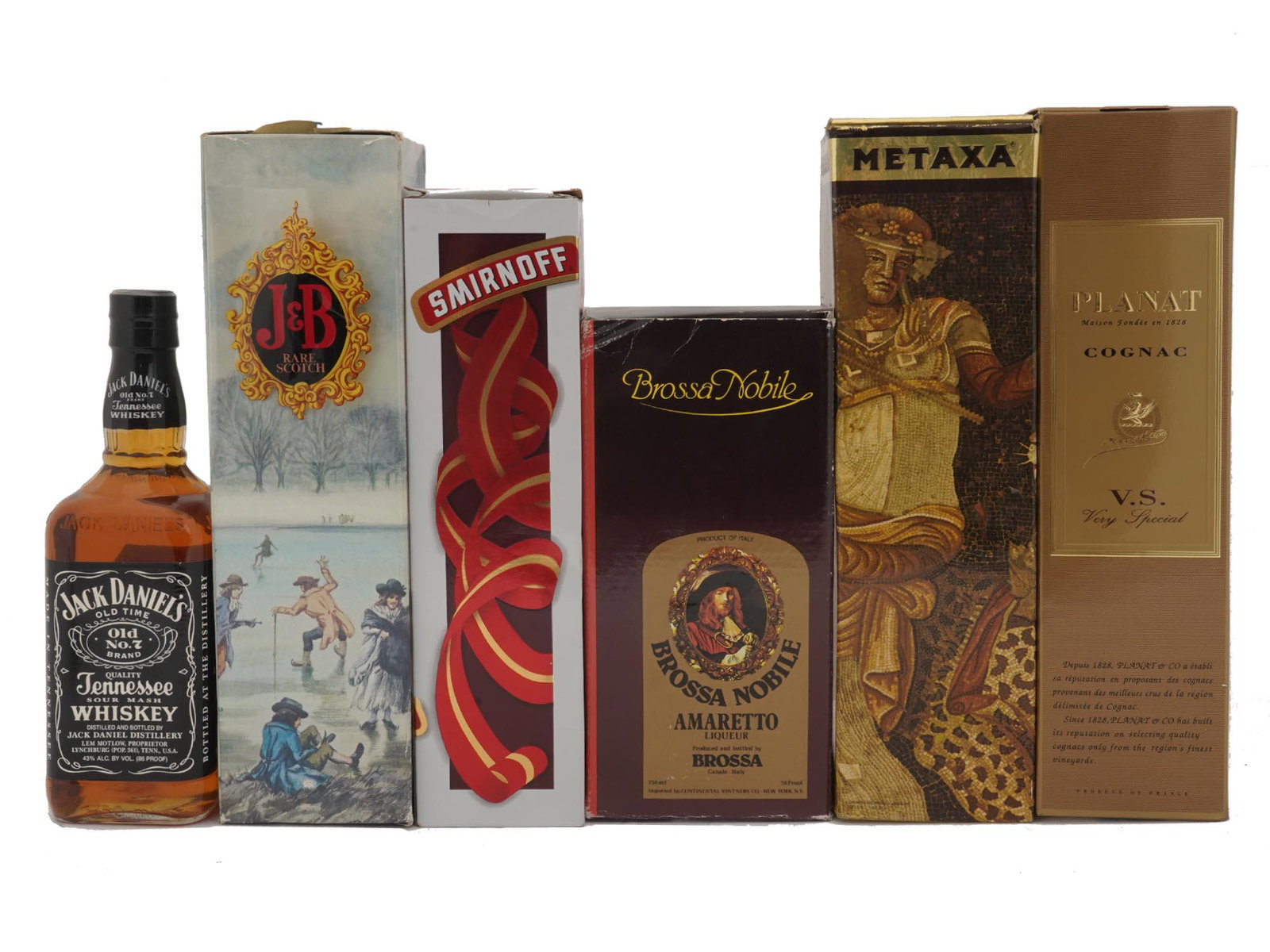 SIX VINTAGE ALCOHOL BOTTLES COGNAC LIQUEUR IOB: A set of six vintage sealed alcohol bottles. Jack Daniels Quality Tennessee Sour Mash Whiskey. J&B Rare Scotch Whisky, in original box. Smirnoff Vodka, in original box. Brossa Nobile Amaretto Liqueur,
