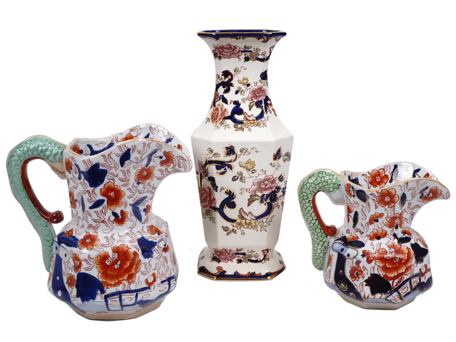 ANTIQUE ENGLISH IRONSTONE PORCELAIN PITCHERS VASE: A set of three antique English Ironstone China items including two jugs of different sizes with Japanese decorations and serpent pattern handles. Both marked on the bottom with a blue Ironstone China 