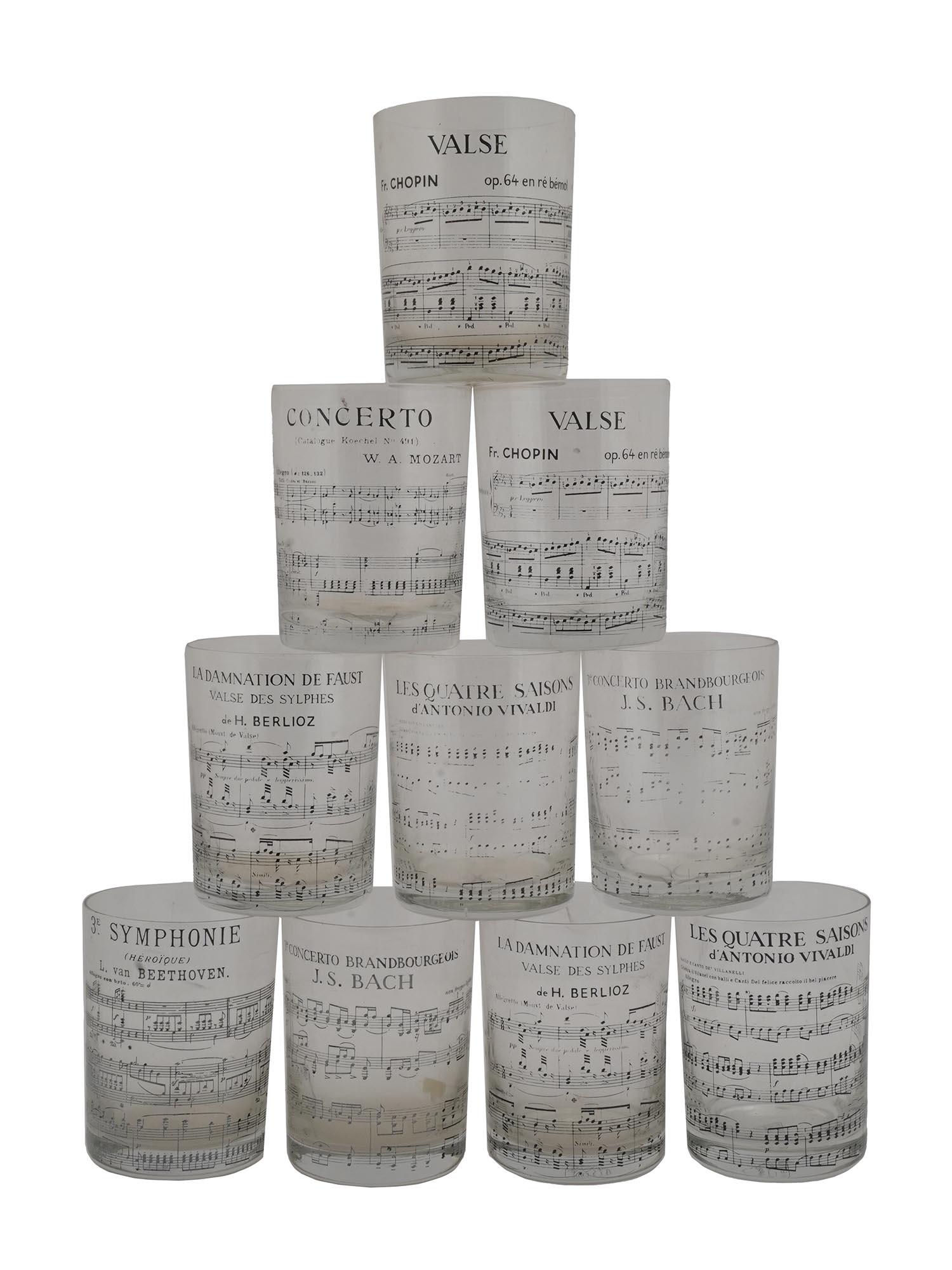 SET OF MID CENTURY CLARY PARIS GLASSES WITH MUSIC: A set of 1950s glasses by Clary Paris, a French glass manufacturer. A total of ten items. Clear glass with printed sheet music of famous classical music pieces, including Valse op. 64 en re bemol by F
