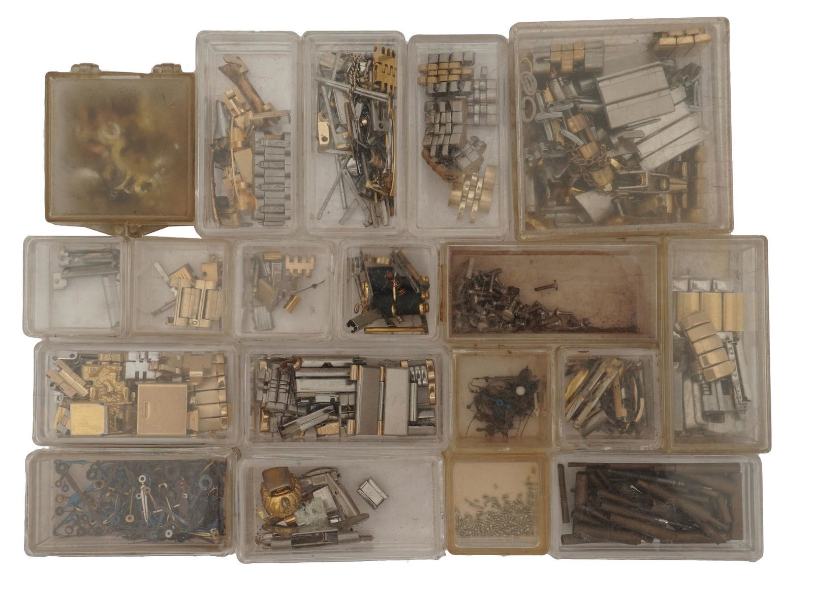 VINTAGE WATCH PARTS, SUPPLY AND TOOLS IN BOXES: A lot of vintage supplies for watch repair. A total of 19 plastic cases with details, tools, and bracelets. Clocks And Wrist Watches Collectables. Dimensions: Box with contents: H: 2 3/4 in. L: 7 in.