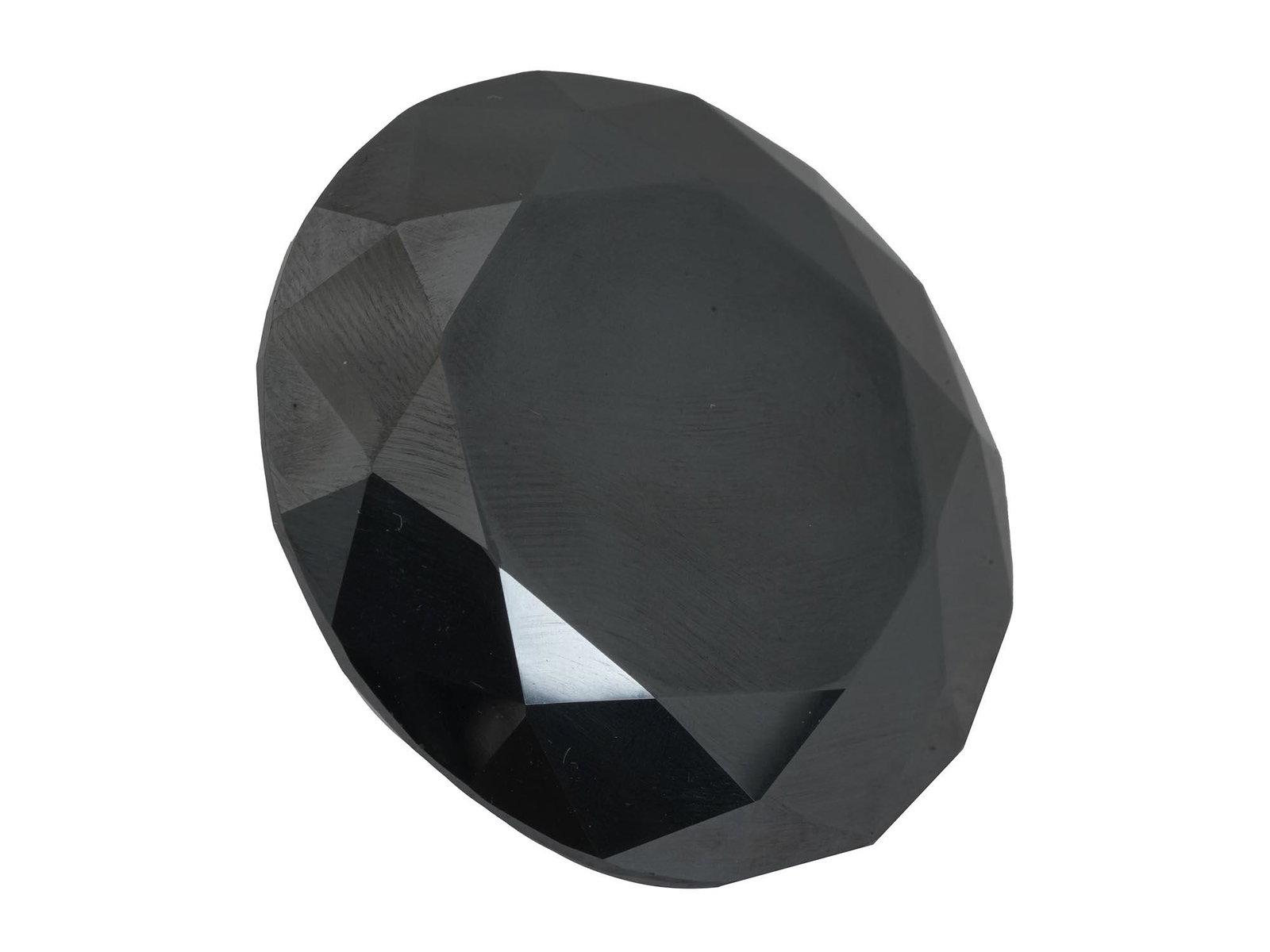NATURAL BLACK 102 CARAT MOISSANITE MINERAL STONE: A natural black moissanite mineral stone. The gemstone is cut in diamond shape, 102 Carats. Gemstone Jewelry, Natural Stones. Dimensions: D 1 3/8 in. All measurements are approximate.