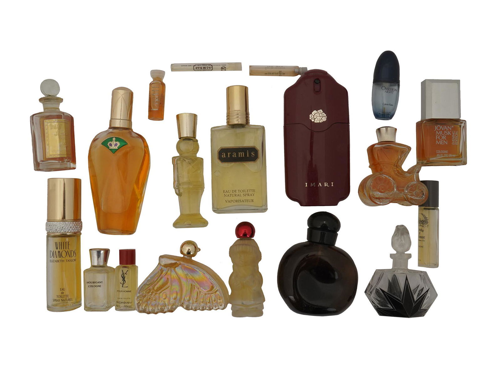 VINTAGE PERFUME BOTTLES YSL JOVAN ROCHAS, 19 PCS: A large lot of vintage perfume bottles and vanity decor. A total of 19 items including White Diamonds by Elizabeth Taylor, Jovan Musk For Men, Yves Saint Laurent, Rochas, Avon Imari, Aramis perfumes.