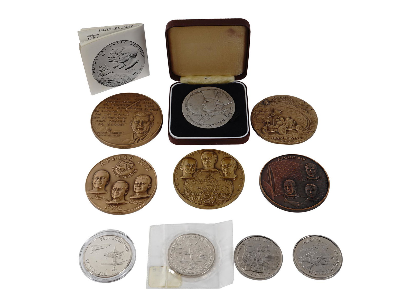 VINTAGE AMERICAN APOLLO SPACE EXPEDITION MEDALS: A collection of commemorative coins and medal including a 1969 bronze Apollo 11 medal designed by Karen Worth commemorating mans first lunar landing with John F. Kennedys speech, a 1970 bronze Apollo 
