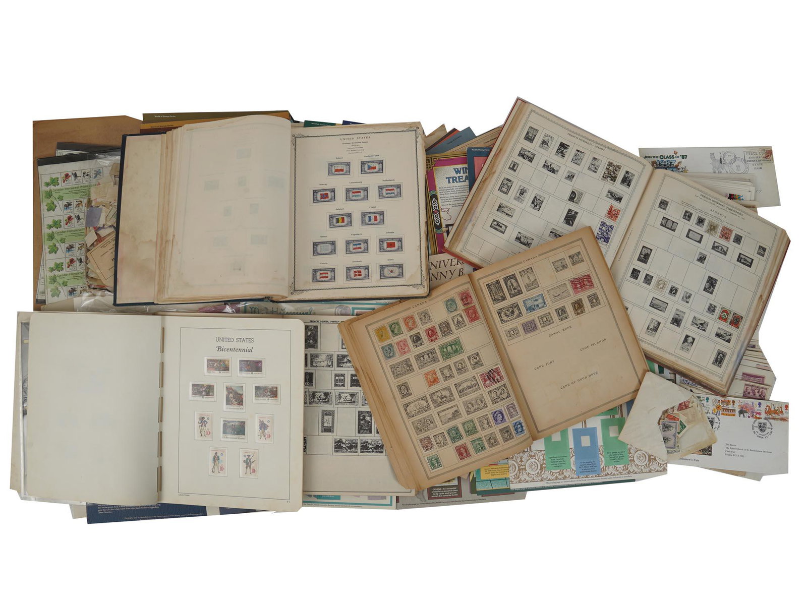 VINTAGE PHILATELY FIRST DAY COVERS AND POSTMARKS: A huge collection of vintage postmarks in albums, including first day covers with envelopes affixed with a stamp or stamps with a postmark and cancellation indicating the date and location, American a