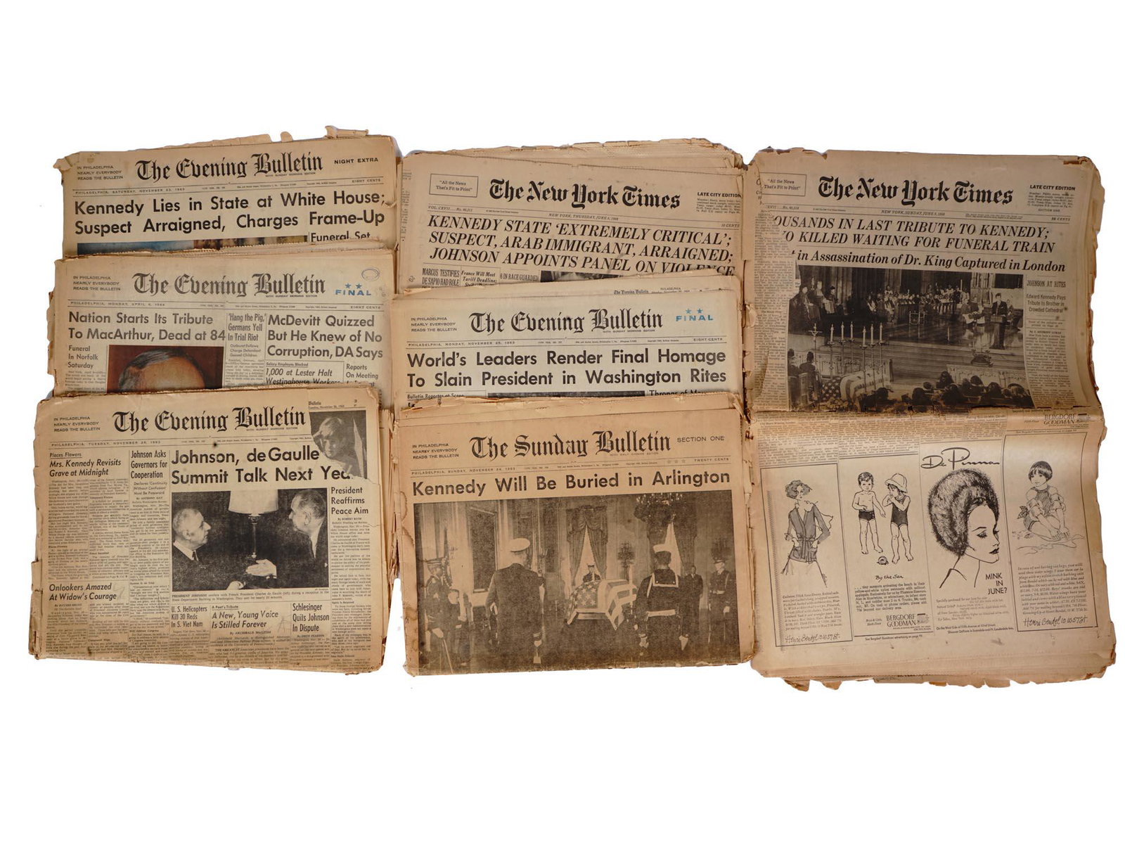 ORIGINAL AMERICAN NEWSPAPERS DEATH OF JF KENNEDY: A lot of seven original mid-century American illustrated newspapers. The Evening Bulletin, November 23, 1963, front page titled Kennedy Lies In State at White House, Suspect Arraigned, Charges Frame U
