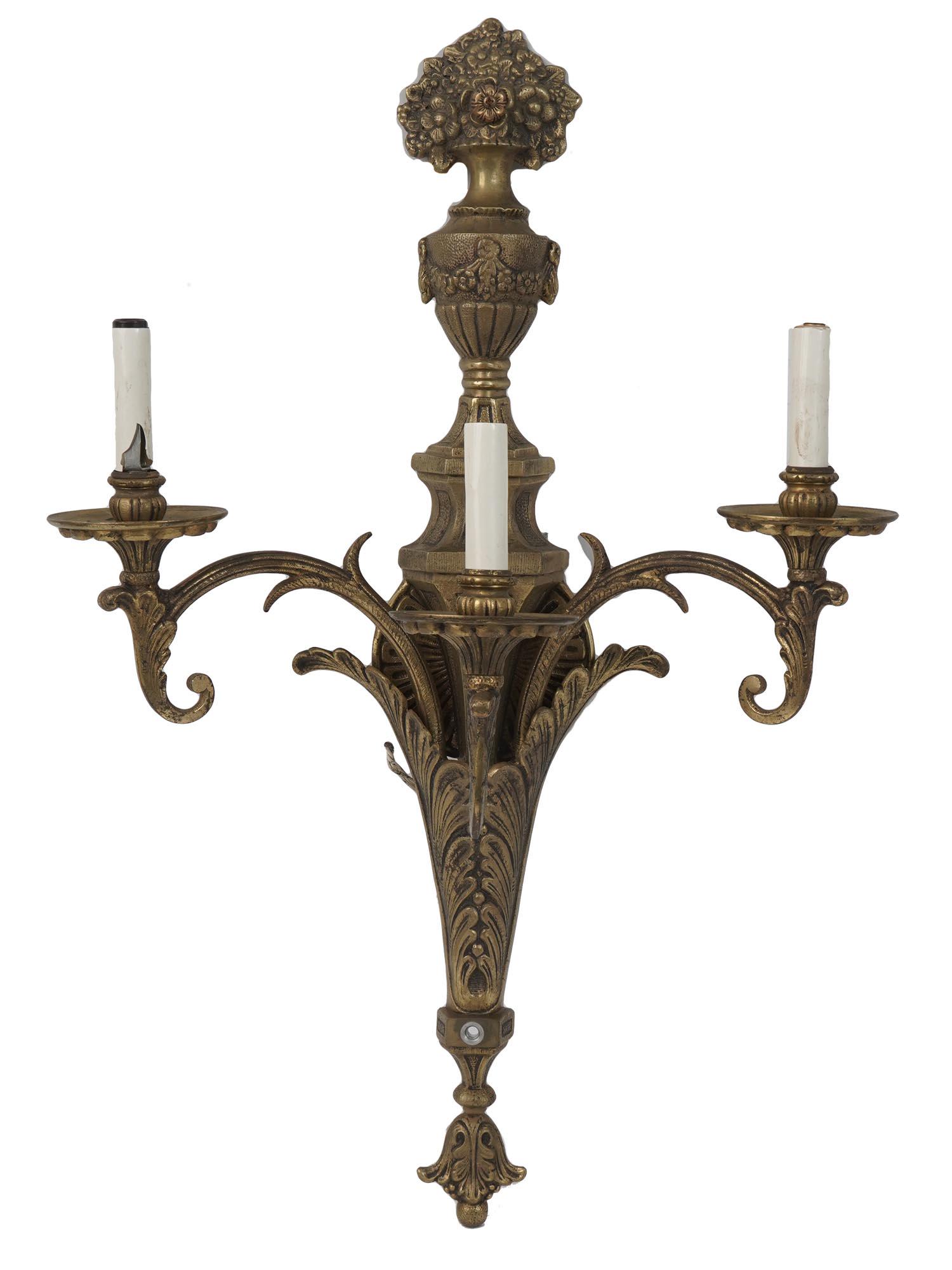 VINTAGE BRONZE CHANDELIER WALL LIGHT FIXTURE: A vintage bronze wall fixture. Forged light fixture with swirls and floral decoration, topped with a flower vase relief. Three light bulbs imitating wax candles. Made in Spain. Items of similar design