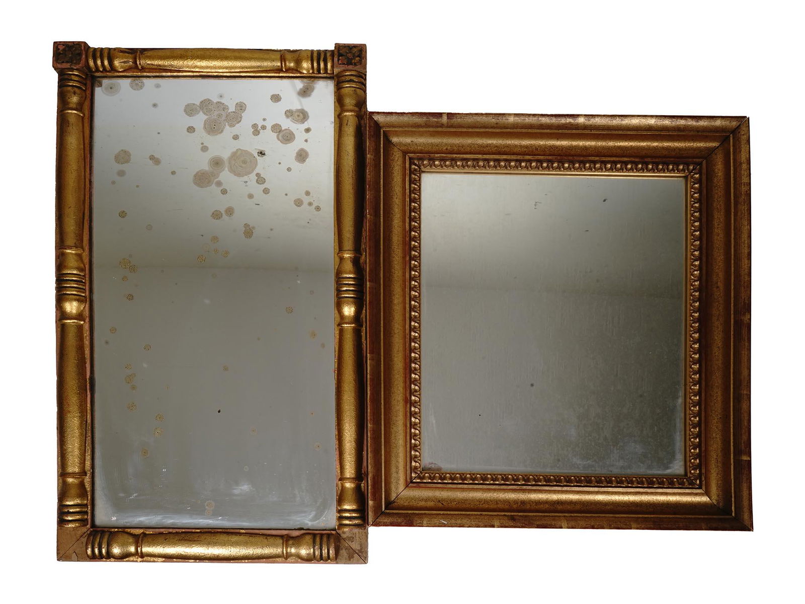 A PAIR OF ANTIQUE MIRROR IN GILT WOODEN FRAMES: A pair of antique mirrors in a gilt wooden frame. The first square shaped frame is adorned with relief floral and columned patterns. The second rectangular shaped frame is decorated with a geometrical