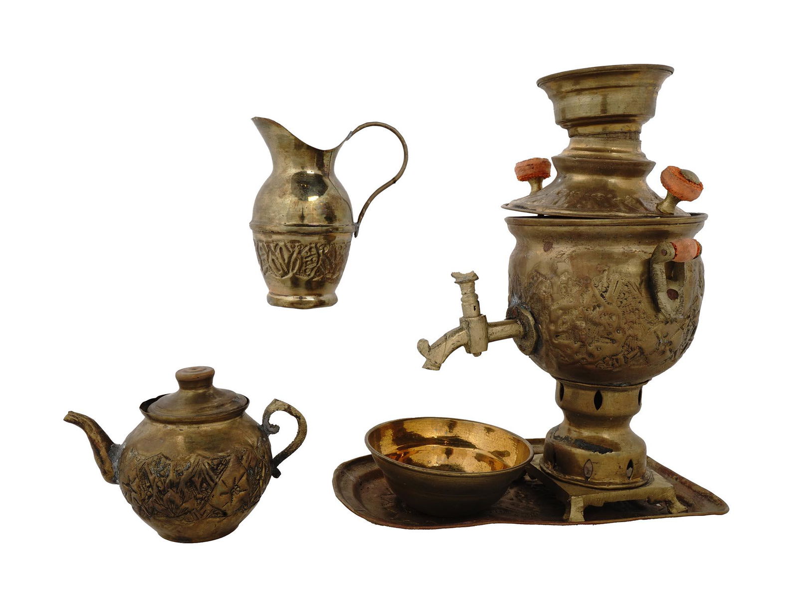ANTIQUE EARLY 20TH C. PERSIAN BRASS SAMOVAR SET: An antique Middle Eastern hand crafted and brass samovar set inspired by the art of the Achaemenid empire and decorated with hand hammered and beautifully engraved details. The set includes a samovar,