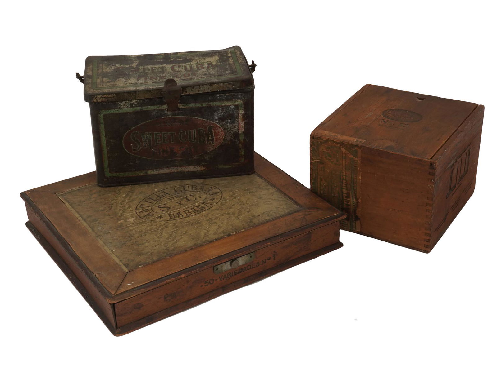 VINTAGE WOODEN AND TIN EMPTY CUBAN CIGAR BOXES: Two vintage wooden and one tin empty Cuban cigar boxes labeled Antilla Cubana, Alfred Dunhill, and Sweet Cuba. Circa the mid 20th century. Vintage Cigar Boxes And Tobacciana Collectibles. Dimensions: