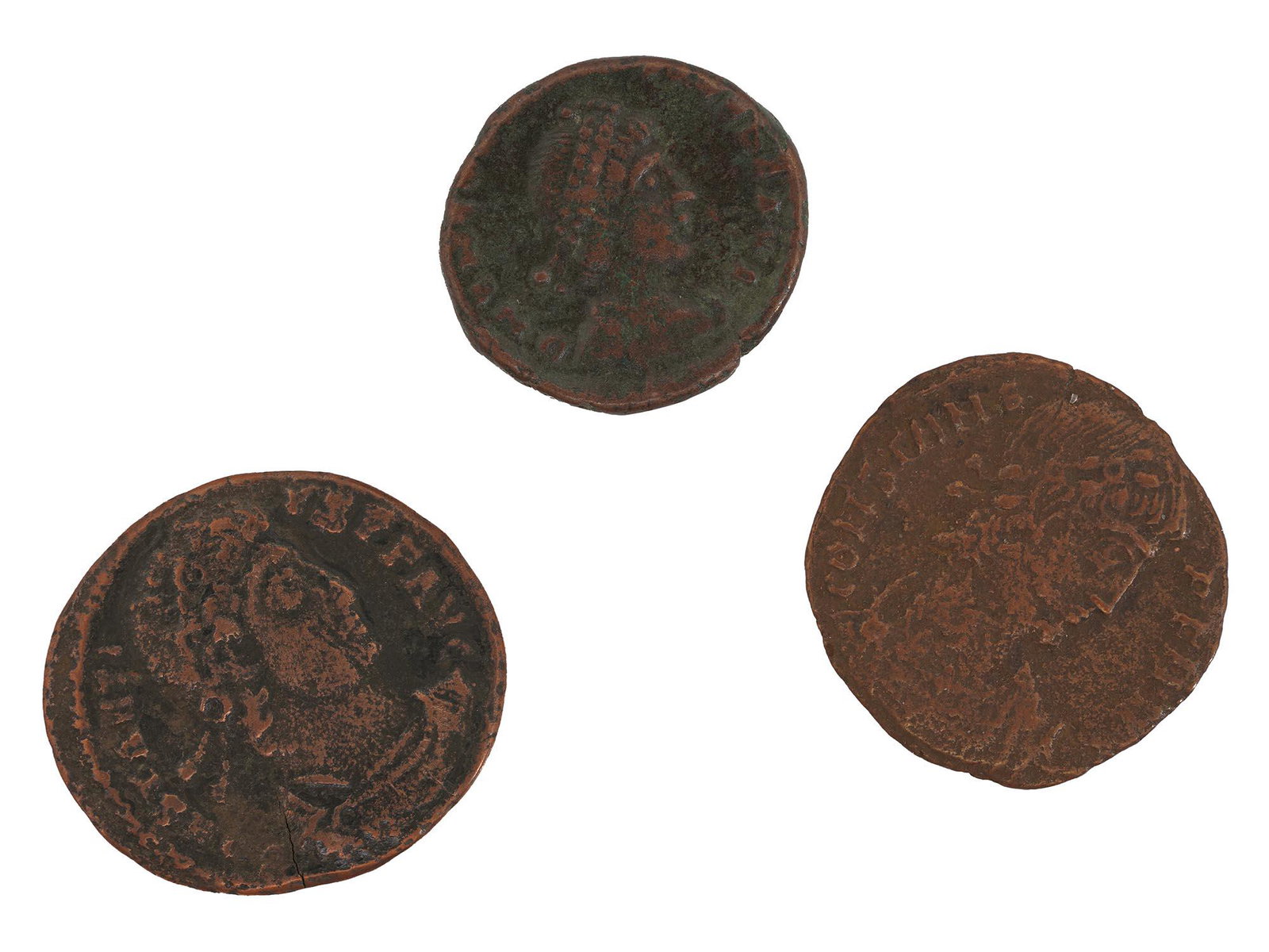 THREE ANCIENT ROMAN EMPEROR CONSTANTINE COINS: Three ancient Roman coins issued in bronze, each holds an Emperor Constantine profile on the obverse. One is depicting two soldiers with spears face each other, with a single standard between them. Th