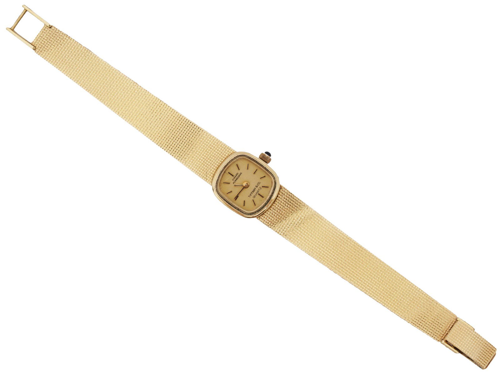 TIFFANY BY GIRARD PERREGAUX 14K GOLD WRIST WATCH: A vintage 14K gold ladies wristwatch made in collaboration of Tiffany and Co. and Girard-Perregaux. Square yellow dial with baton indexes, inscription Tiffany and Co., Girard Perregaux Quartz. The wat