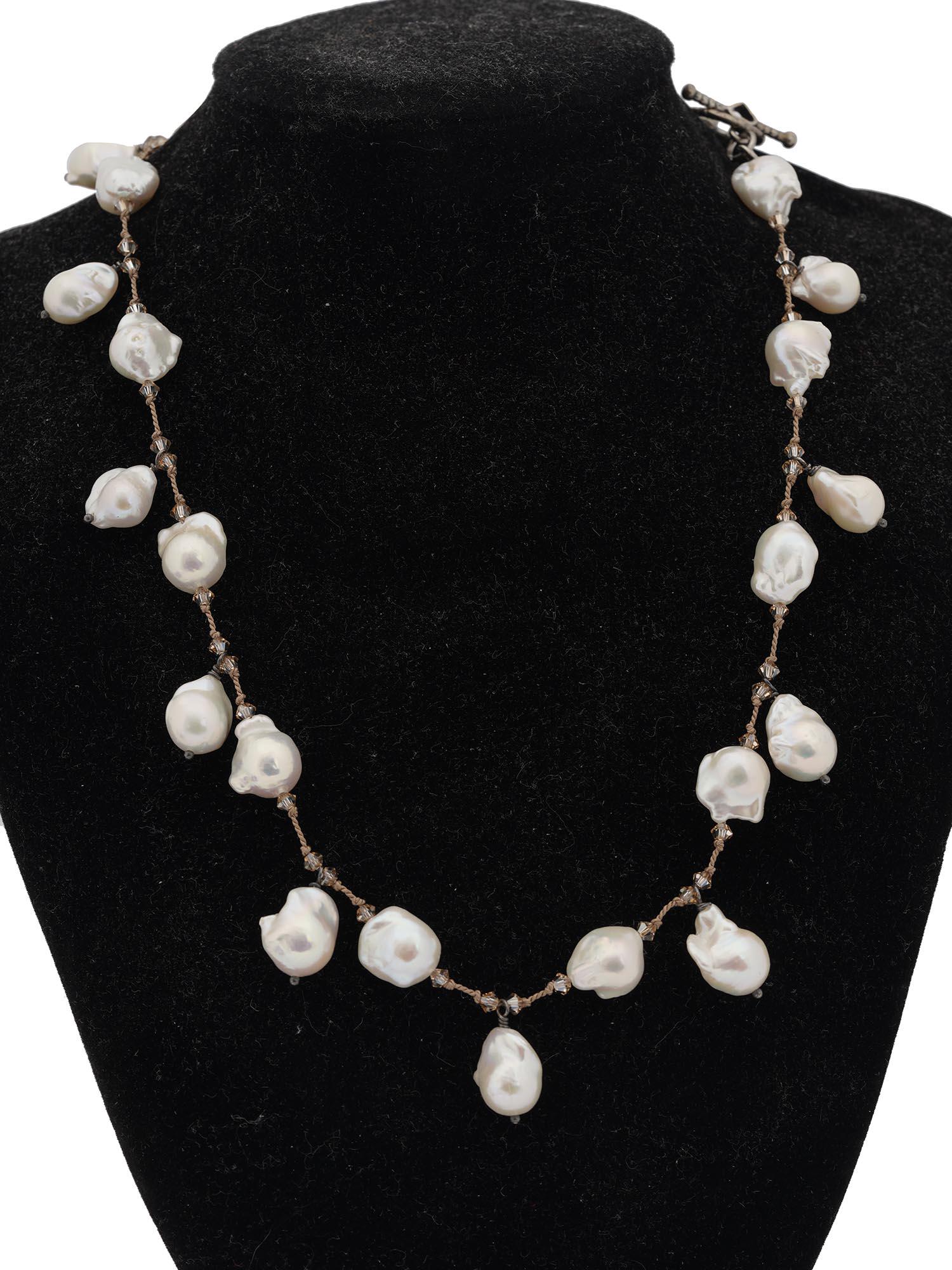 VINTAGE BEADED NECKLACE W CULTURED BAROQUE PEARLS: A vintage rope necklace garnished with 25 baroque pearls and transparent beads. The necklace has a heart-shaped toggle clasp. The item comes with a box. Fashionable Statement Jewelry For Women. Dimens