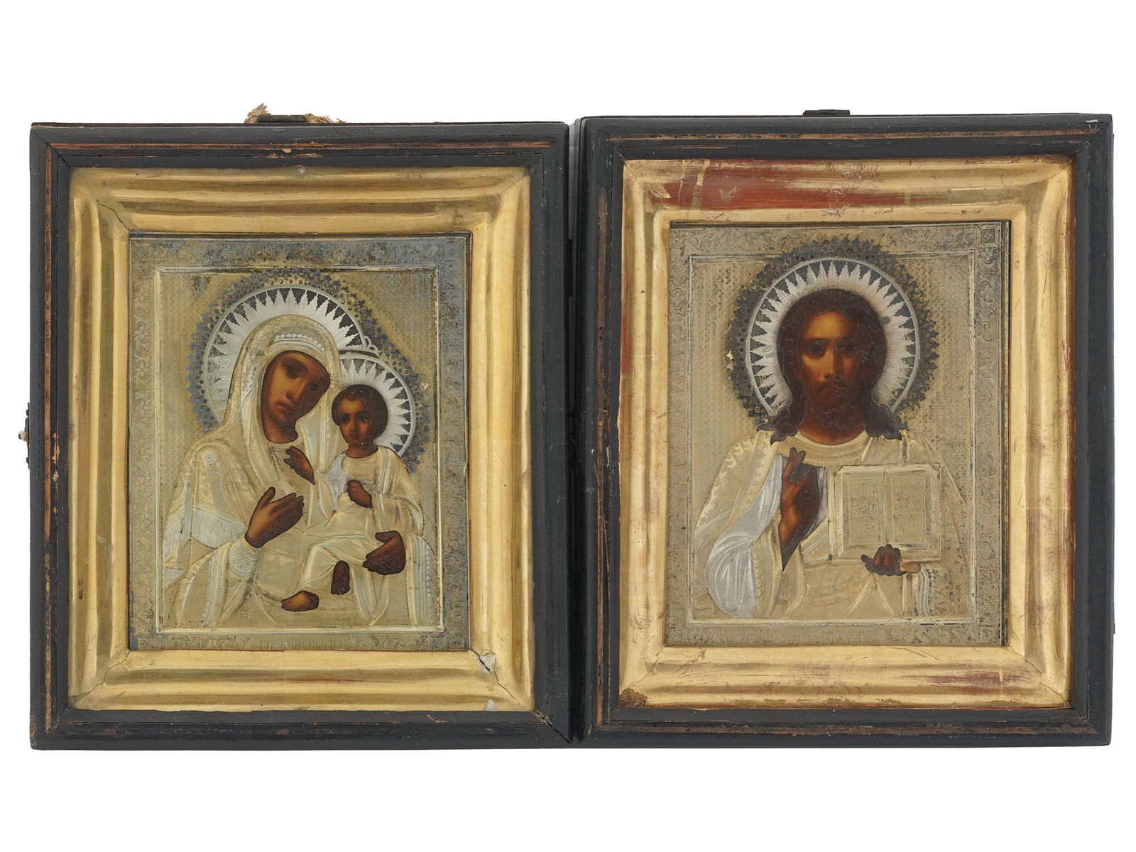 ANTIQUE RUSSIAN GILT SILVER WEDDING ICON PAIR: Two antique 19th-century Russian Orthodox icons. A wedding couple is a conventional name for a composition of two icons, the Savior and the Most Holy Mother of God, which is used during the sacrament