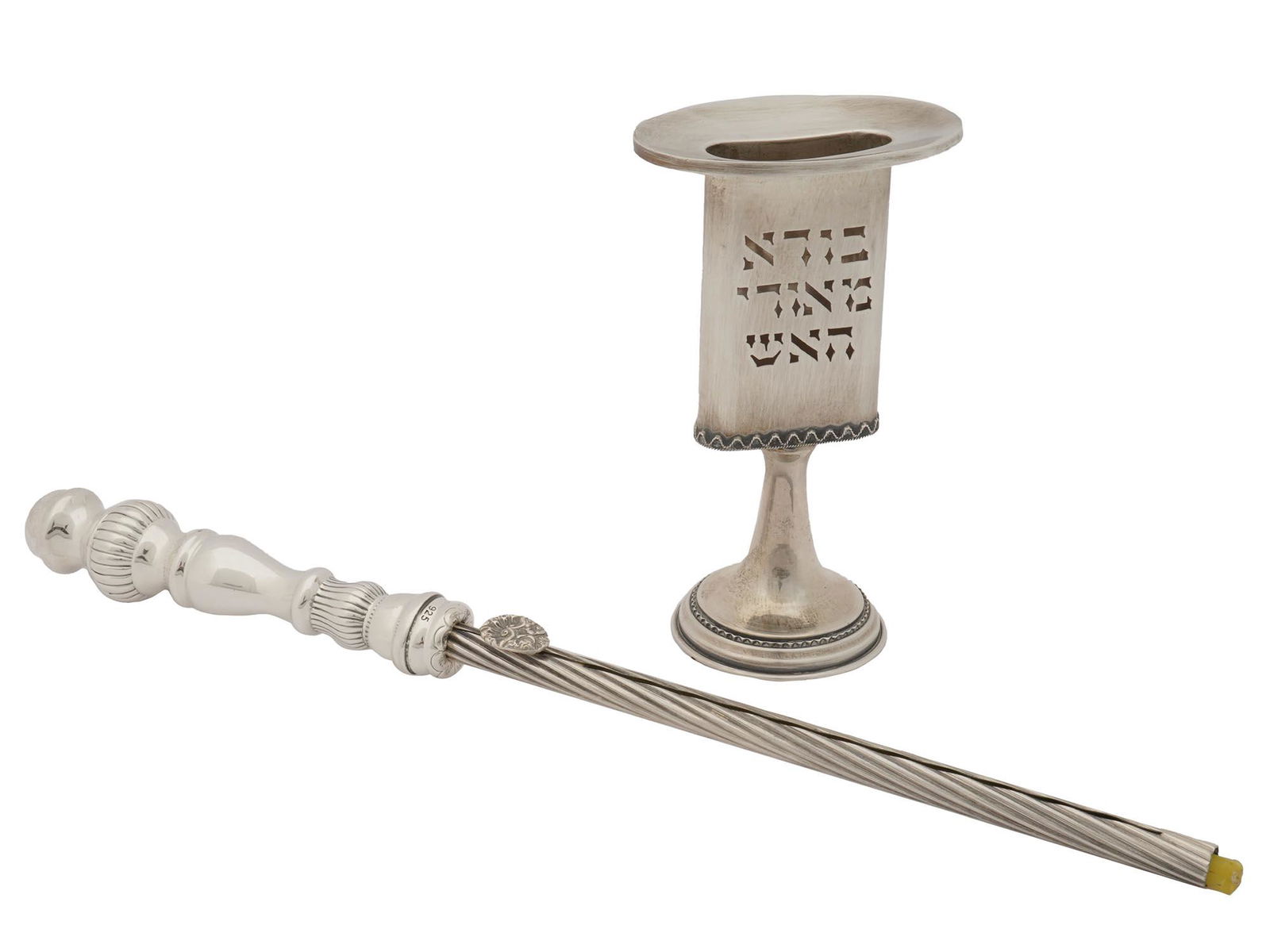 PAIR OF JUDAICA STERLING SILVER CANDLE HOLDERS: A pair of Judaica sterling silver candle holders. The first candle holder is adorned with a stick engraved with a swirl pattern. The second candle holder is decorated with a fluted neck and a leg, an