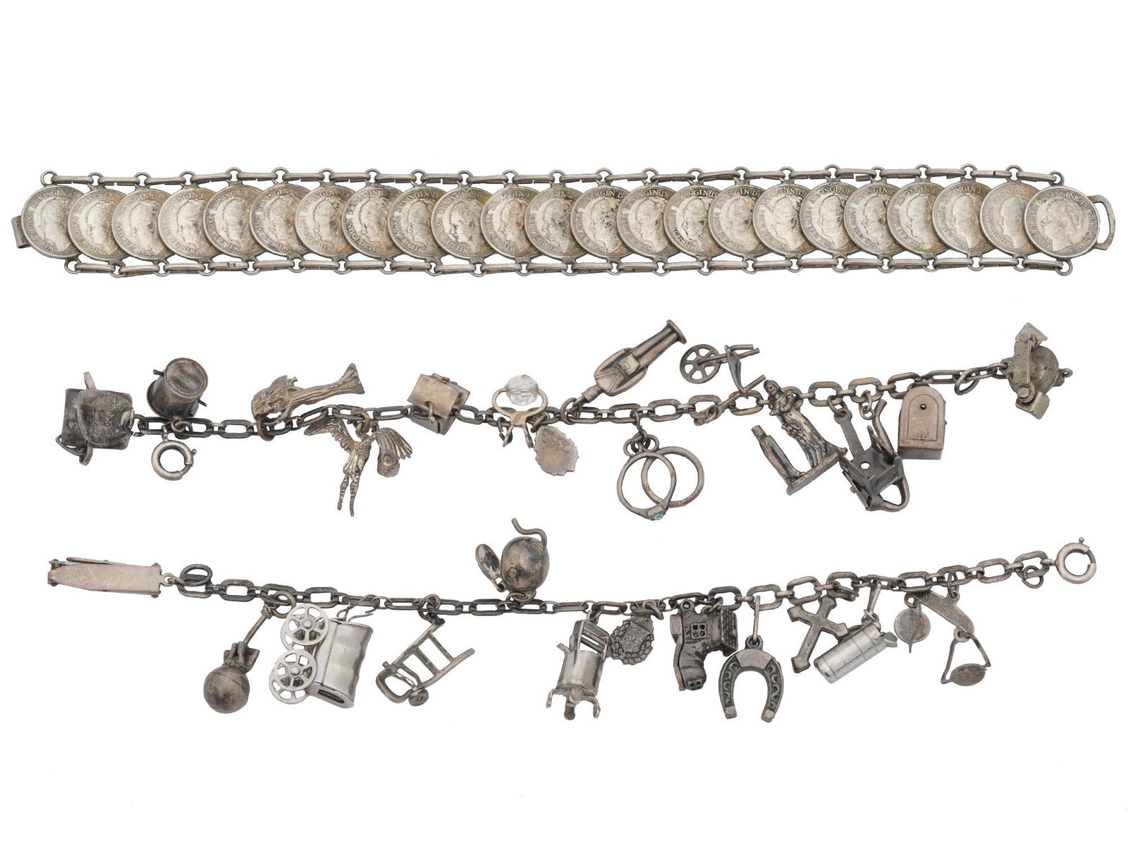 WILHELMINA COIN BRACELET, SILVER CHARM BRACELETS: A lot of vintage silver-tone bracelets. Two silver chain bracelets with figurative silver charms, hallmark Sterling is on the clasps. A link bracelet made of twenty-three Dutch silver 10 cent coins, i