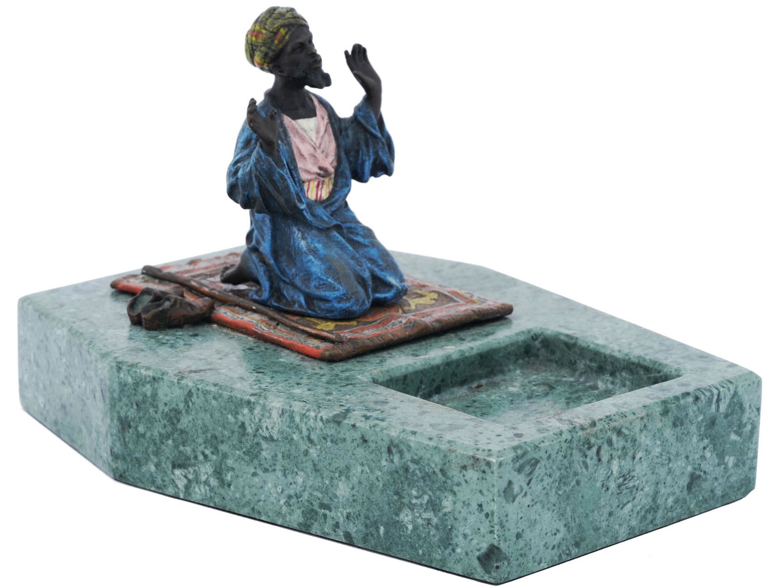 ANTIQUE AUSTRIAN BRONZE PRAYER FIGURE ASHTRAY: An antique Austrian cold-painted bronze Oriental figurine depicting an Arab man in prayer on a rug with shoes and a walking stick. Manufactured by the Franz Bergmann factory, circa the early 20th cent