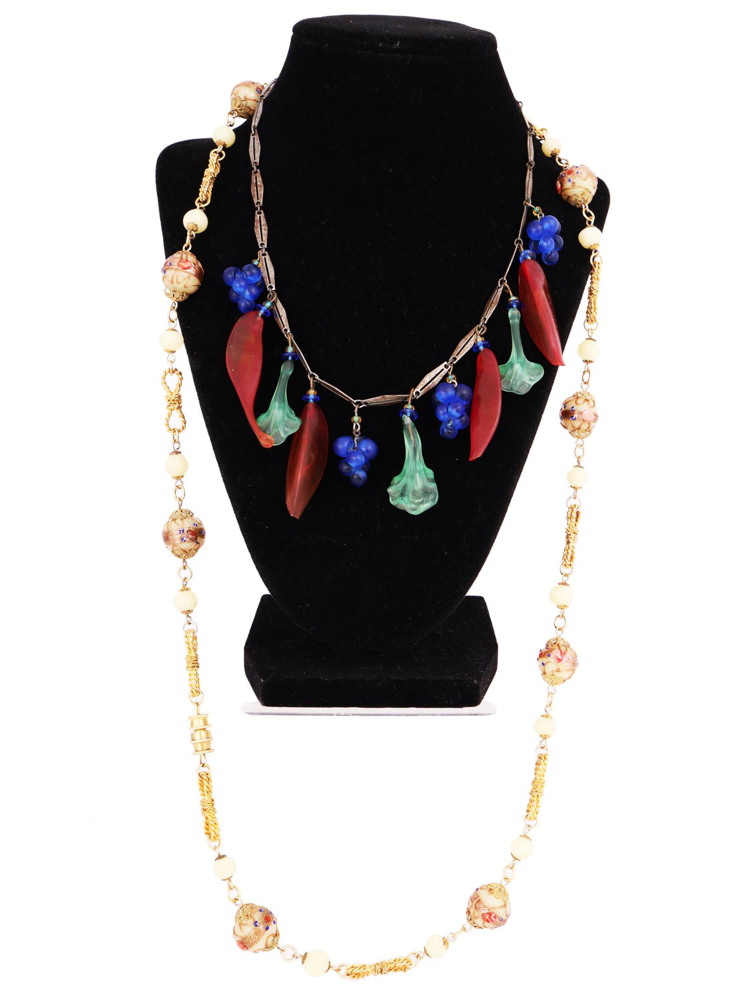 PAIR OF MURANO GLASS GOLD TONE CHAIN NECKLACES: A lot of two vintage necklaces. First. A gold-tone link chain necklace with blown Murano glass charms representing grapes, papers, salad greens. Second. A long gold-tone with metal and Venetian glass 