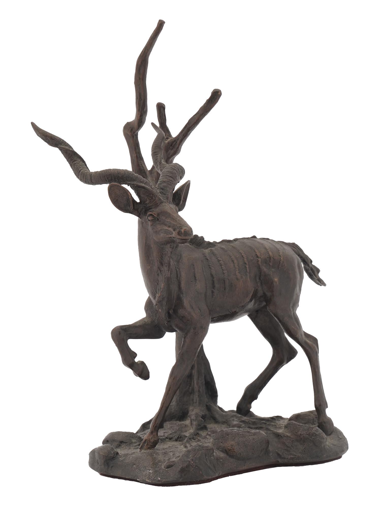 BRONZE FIGURE GREATER KUDU BY THE FRANKLIN MINT: A bronze figure, Greater Kudu, S. Strepsiceros, by the Franklin Mint. The figure depicts a standing woodland antelope. Mounted on a relief base. Circa: late 20th century. Marked and inscribed on the b