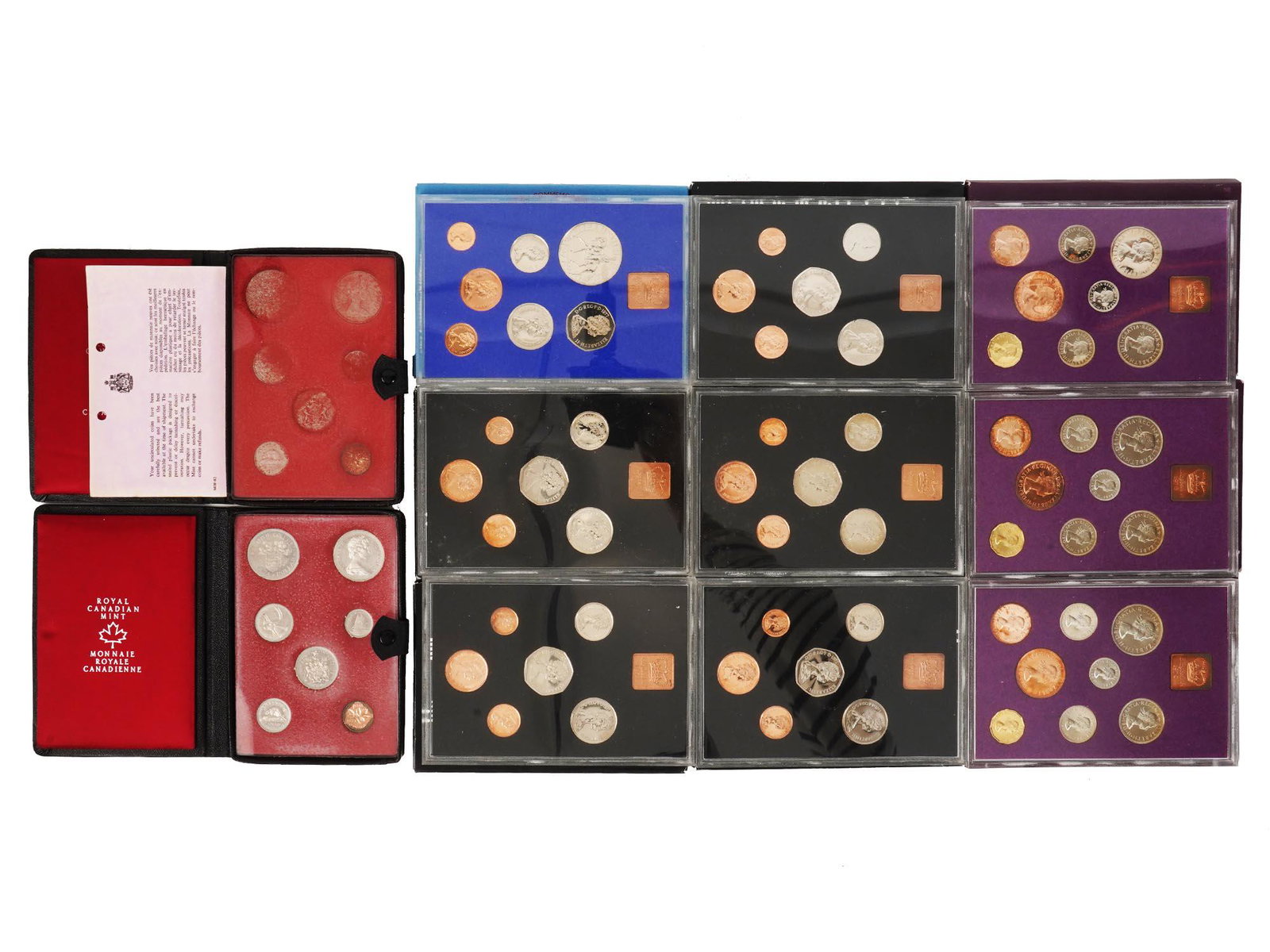 COINAGE OF GREAT BRITAIN AND NORTHERN IRELAND SET: A coinage of Great Britain, Northern Ireland, and Canadian set of eleven boxes. Presented in boxes or leather cases. Marked, Coinage of Great Britain and Northern Ireland 1977, The Decimal Coinage of 