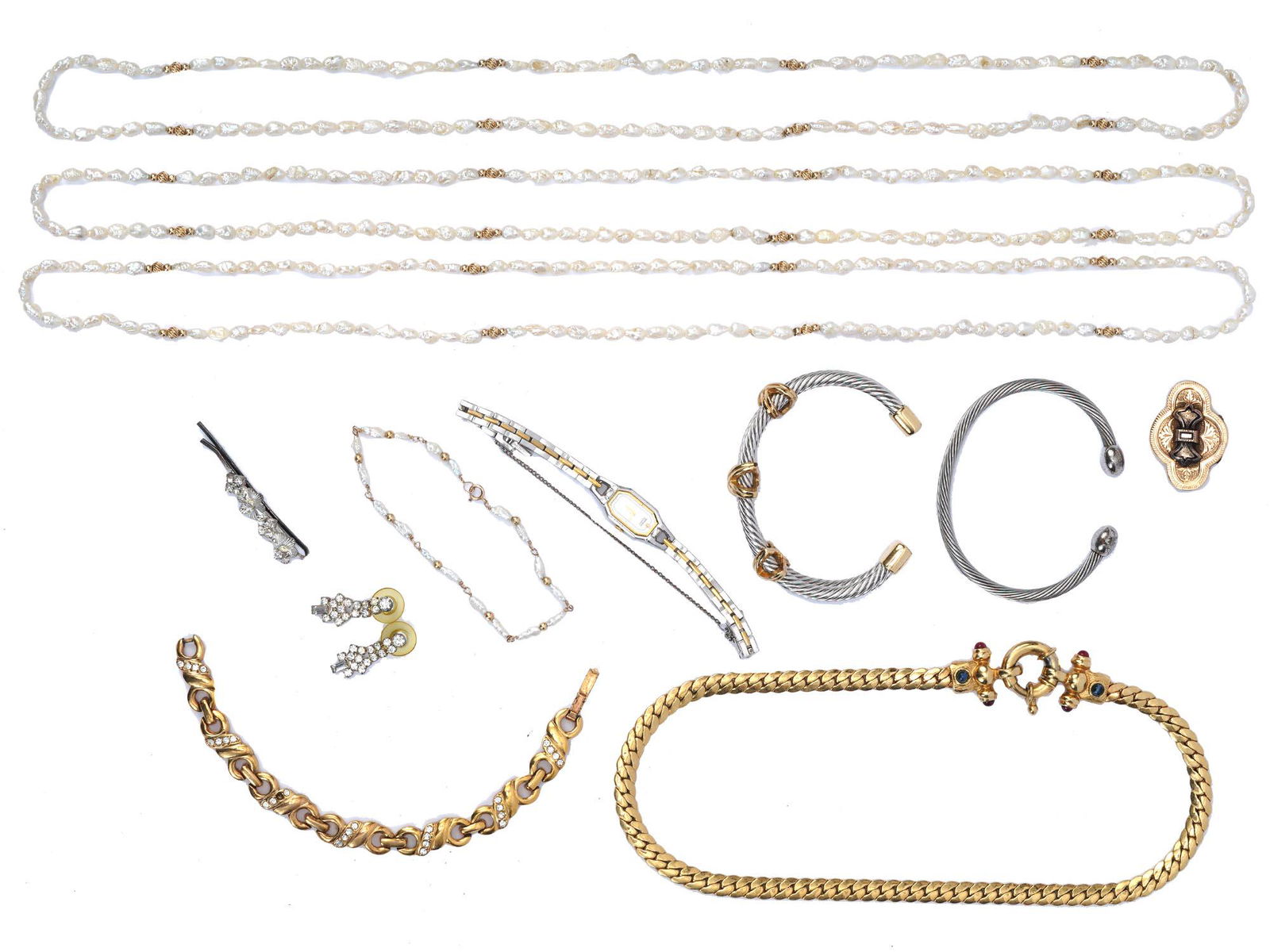 LOT OF COSTUME JEWELRY AND SEIKO STEEL WRISTWATCH: A large lot of vintage costume jewelry. A total of 11 items including three baroque pearl string necklaces and a matching bracelet, a brooch, a pin, a pair of earrings, two cuff bracelets, a chain nec