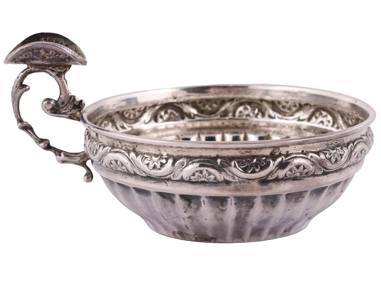 ANTIQUE SILVER TASTEVIN PORRINGER W. COIN, 19TH C: A fine antique European tasting wine cup decorated with embossed floral motifs with patinated deeps, inset with an authentic 1617 Spanish Philip III 8 Reales coin to the bottom and other silver coin t