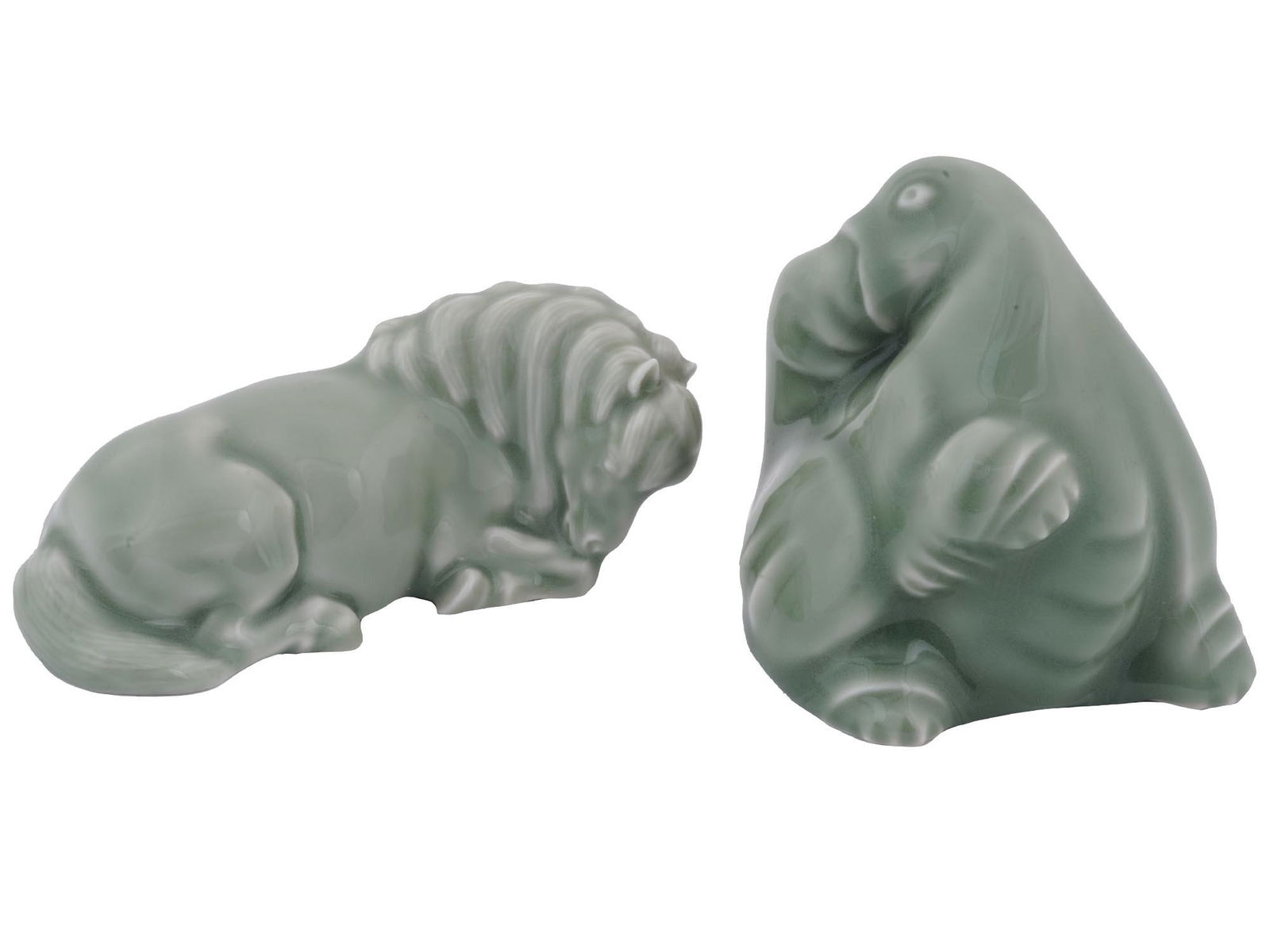 ROYAL COPENHAGEN JAIS ANIMALS PORCELAIN FIGURINES: A pair of Danish Royal Copenhagen glazed porcelain figurines. The figurines depict animals, a horse, and an elephant. Modeled by Jais Nielsen, Dannish, 1885 to 1961. The figurines are covered with ena