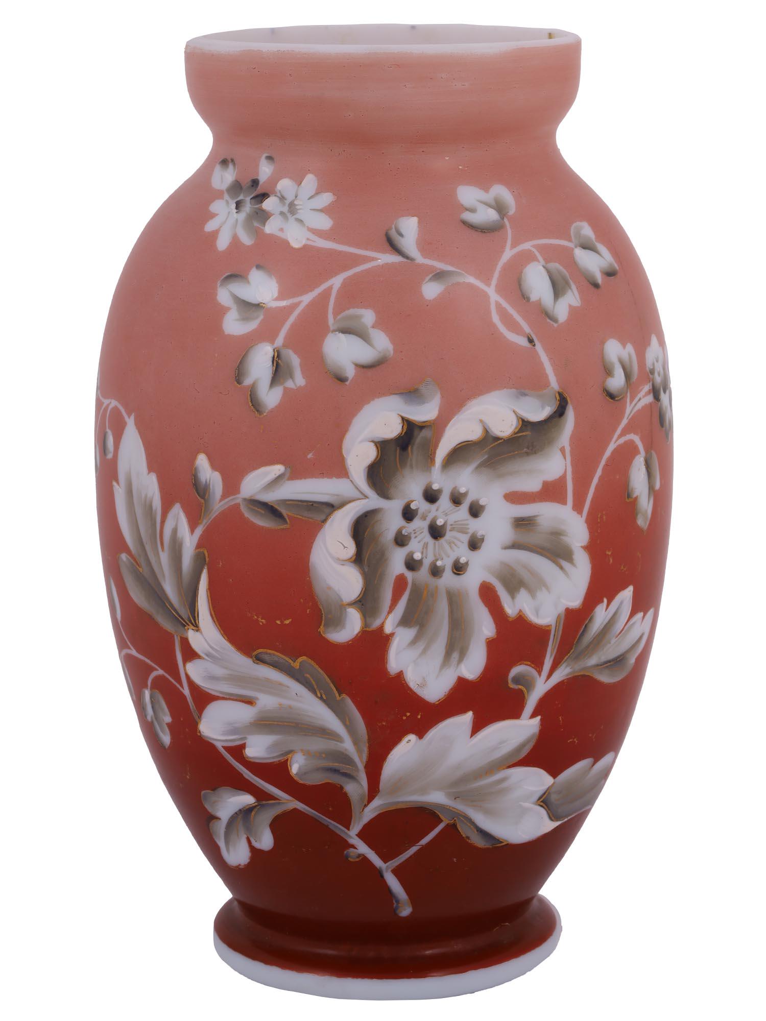 ANTIQUE FLORAL HAND PAINTED OPALINE GLASS VASE: An antique European pink and red opaline glass vase. The body of the vase is adorned with a hand painted floral pattern. Numbered, 9, on the bottom. Unmarked. Circa: the late 19th century to the early