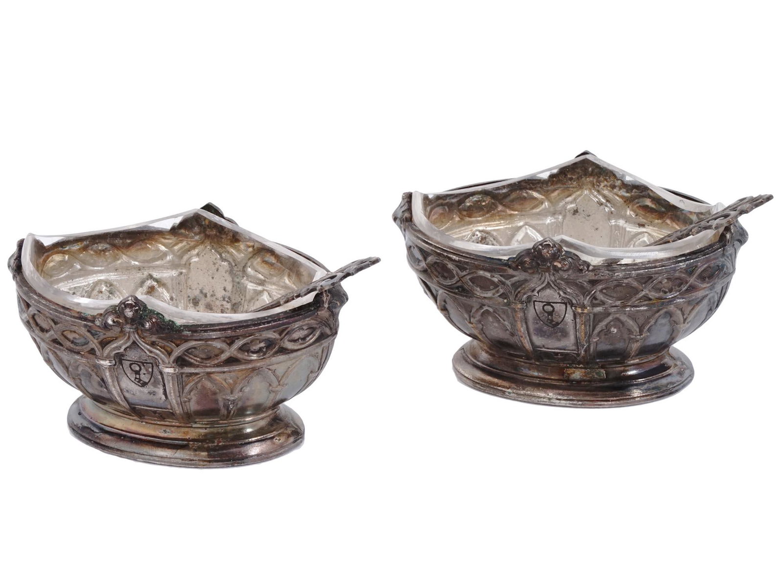 NAZI GERMAN GOERING SALT PEPPER BOWLS AND SPOONS: A Nazi German salt and pepper set consisting of two chiseled oval bowls with interior glass forms and two spoons manufactured in the same manner. Used to belong to Hermann Goering as each bowl feature