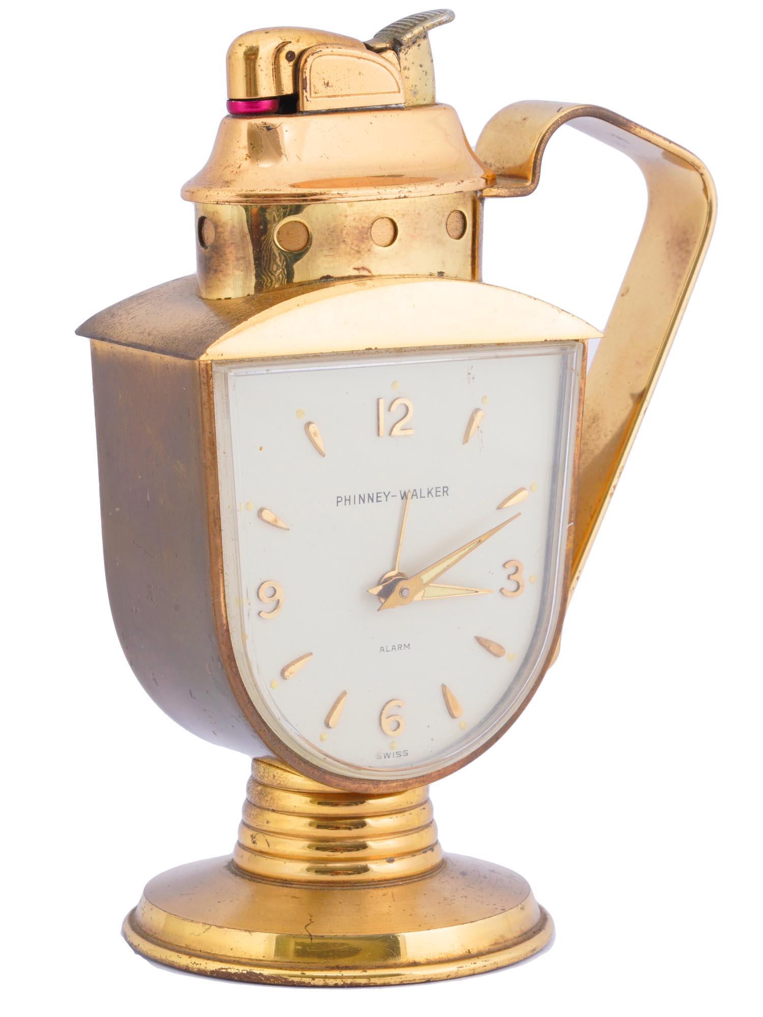 AMERICAN PHINNEY WALKER EVANS ALARM CLOCK LIGHTER: A Mid century American Phinney Walker and Evans alarm clock with a lighter. Swiss made and has a 30 hour mechanical movement. The clocks face has gilt figures, hours indicators with cream and gold lum
