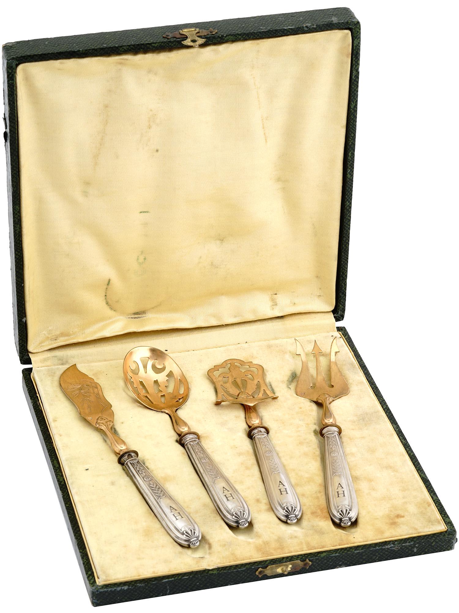 NAZI GERMAN WWII HITLER SILVER TABLEWARE FISH SET: A Nazi German WWII era silver tableware fish set of four items with gilt lower tool parts. The handles are decorated with a twisted floral design and hallmarked with the silver proof marks. Each holds