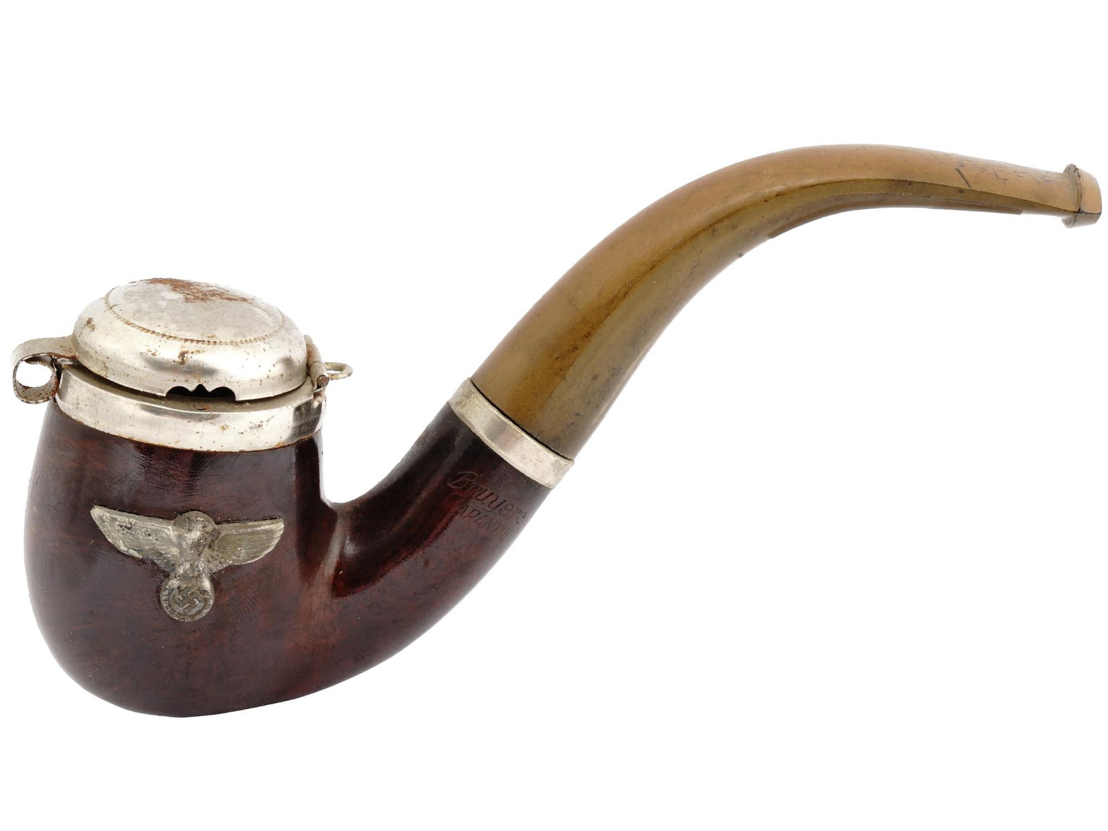 WWII GERMAN NAZI BRUYERE WOOD SMOKING PIPE.: A WWII Nazi German Third Reich Bruyere Garantie wooden smoking pipe. The smoking pipe is adorned with a hinged metal wind cap and a metal eagle swastika insignia plaque on the side. Marked, Bruyere Ga