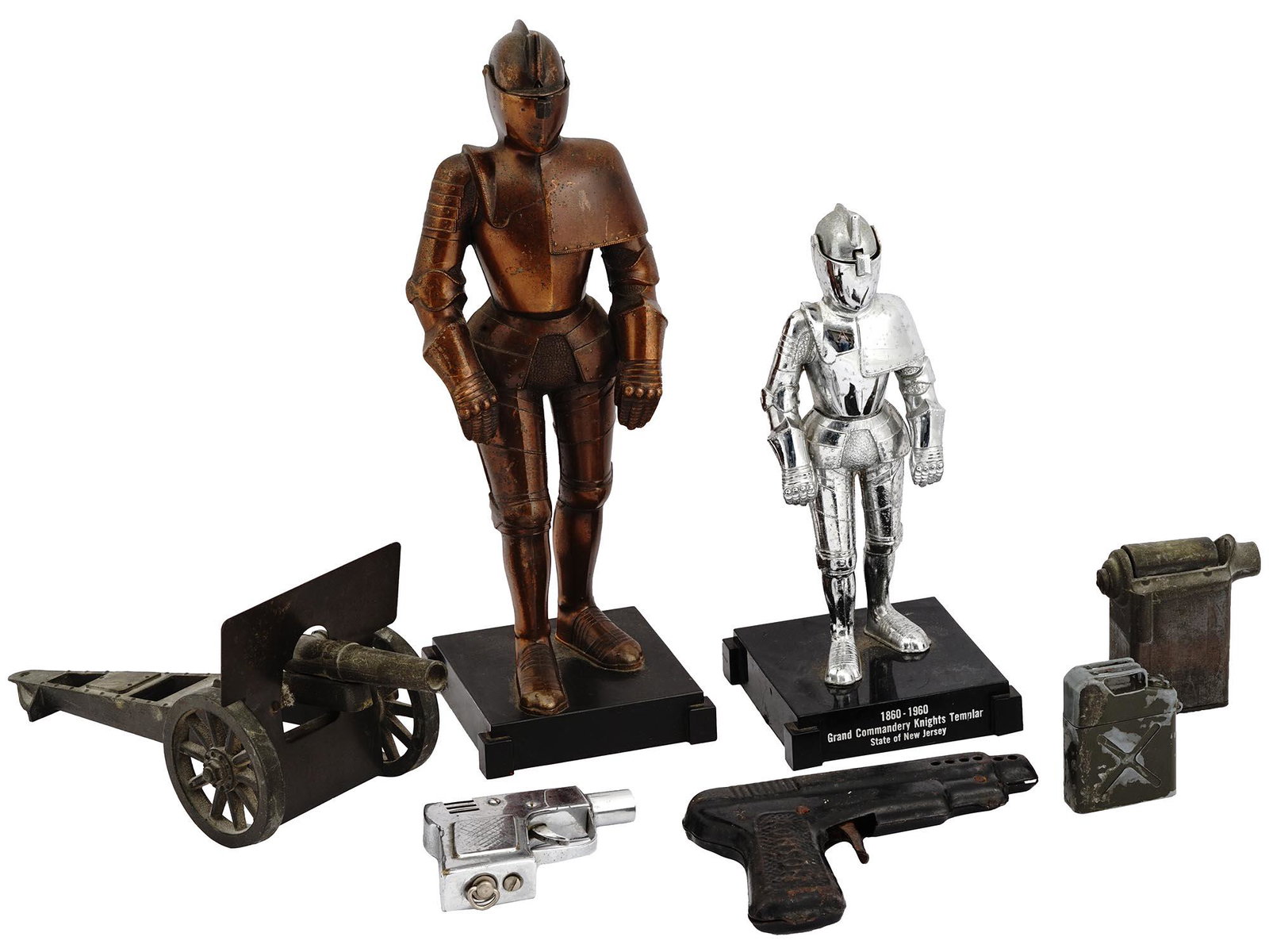 MILITARY DESKTOP LIGHTERS AND MASONIC FIGURINES: A lot of vintage military-themed desktop lighters. A total of five items, two gas can lighters and two pistol lighters by Ronson, and a desktop cannon lighter. The lot also includes two identical moun