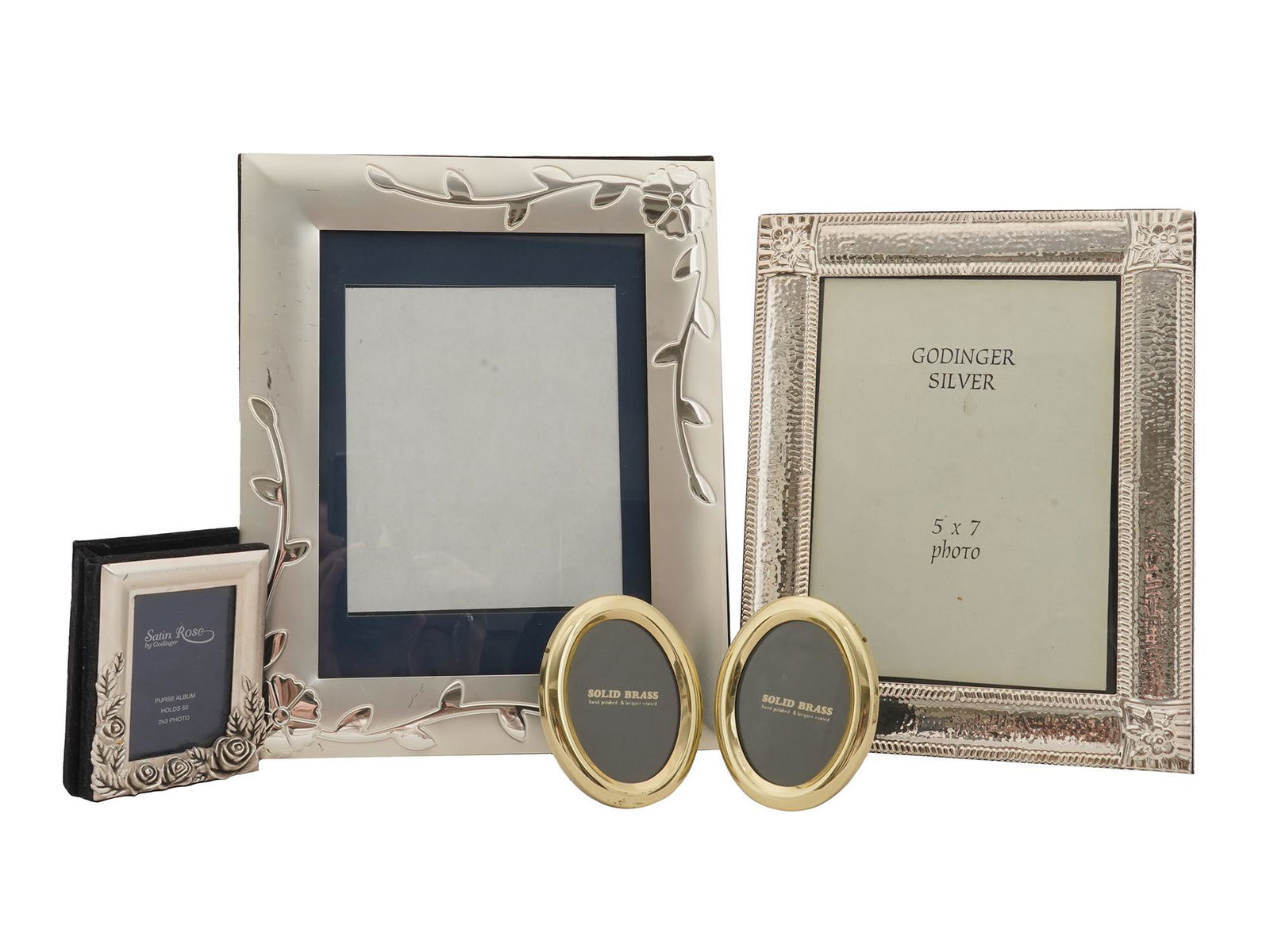 COLLECTION OF FIVE VINTAGE ALBUM PICTURE FRAMES: A collection of five various vintage picture frames. The collection includes one silver tone plate adorned with an engraved floral pattern; a Godinger Silver photo frame with a ribbed design and a flo