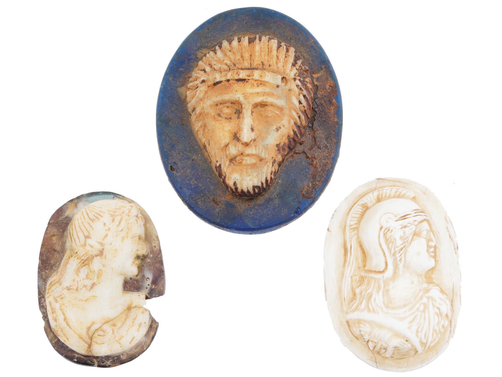 ANCIENT ROMAN GLASS, ALABASTER AND BASALT CAMEOS: A lot of three Ancient Roman cameo pieces made of glass, alabaster, and basalt. Late Imperial Rome, 4 to 5 AD. The pieces represent relief human profiles. Historical ArchaeÐ¾logical Collectables, An