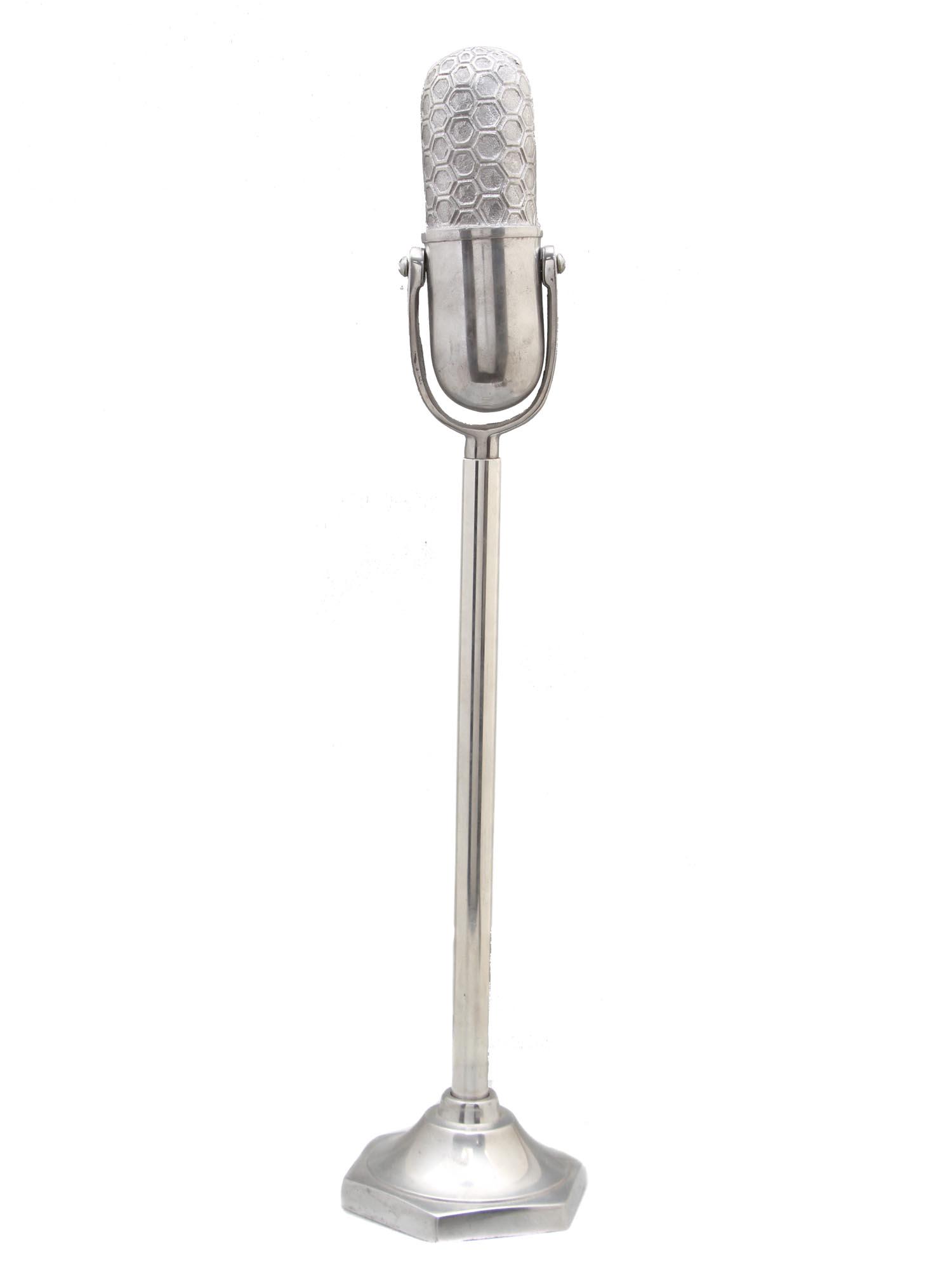 A VINTAGE TALL MICROPHONE STANDING SCULPTURE: A vintage Grayson Lane tall silver aluminum microphone sculpture for table decor. Crafted from lightweight yet sturdy aluminum and finished in a monochrome metallic silver. Retro Decor Accessories Acc