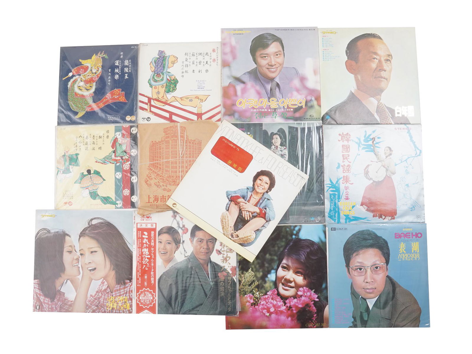 RARE VINTAGE KOREAN POP FOLK MUSIC LP RECORDS: A lot with 13 vintage Korean vinyl recordings including Korean Folk Songs, Cho Mi MI, Baeho, and more. Far East modern music. Dimensions: Average 12 1/4" x 12 1/4 in. All measurements are approximate