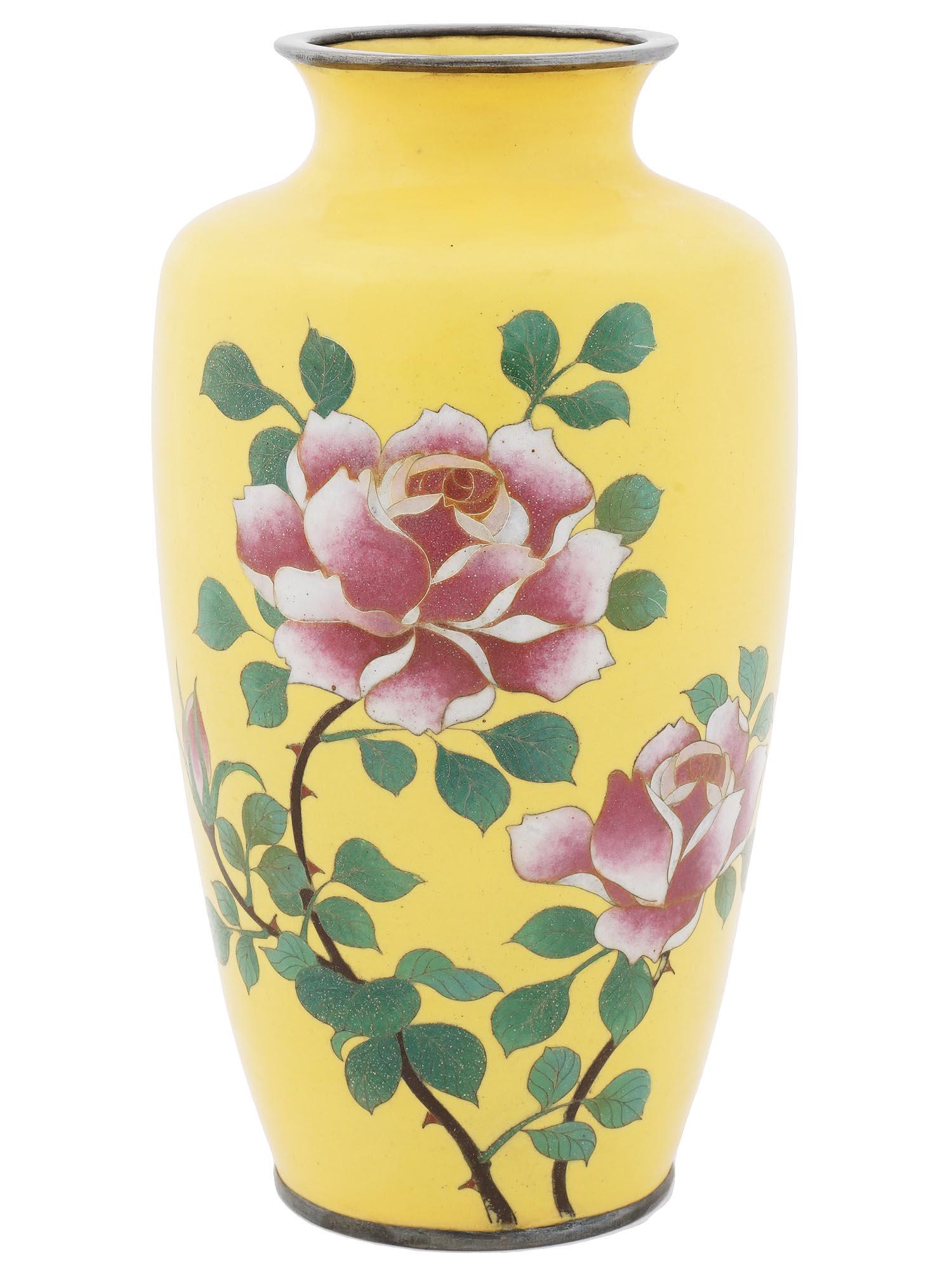 ANTIQUE MEIJI ERA JAPANESE CLOISONNE ENAMEL VASE: An antique Japanese Meiji Era brass and enamel vase. Circa: early 20th century. The baluster form vase is enameled with polychrome images of blossoming flowers and plants made in the Cloisonne techniq