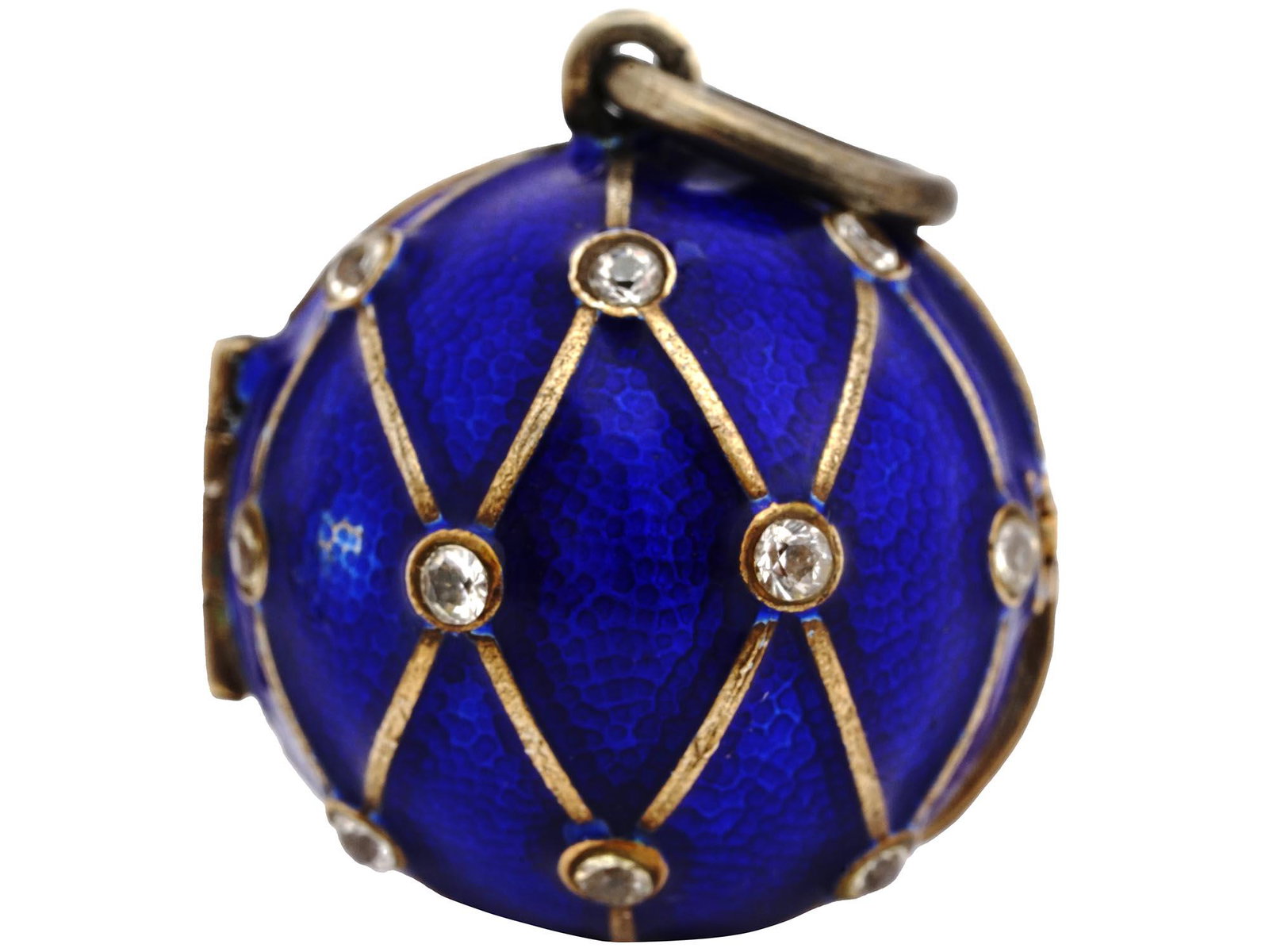 RUSSIAN 84 GILT SILVER AND DIAMOND LOCKET PENDANT: A Russian 84 Gilt Silver round shaped and enamel locket pendant. The pendant consists of two fastened halves. A gilt wash interior with an empty place for storage of memorabilia. The exterior of the e