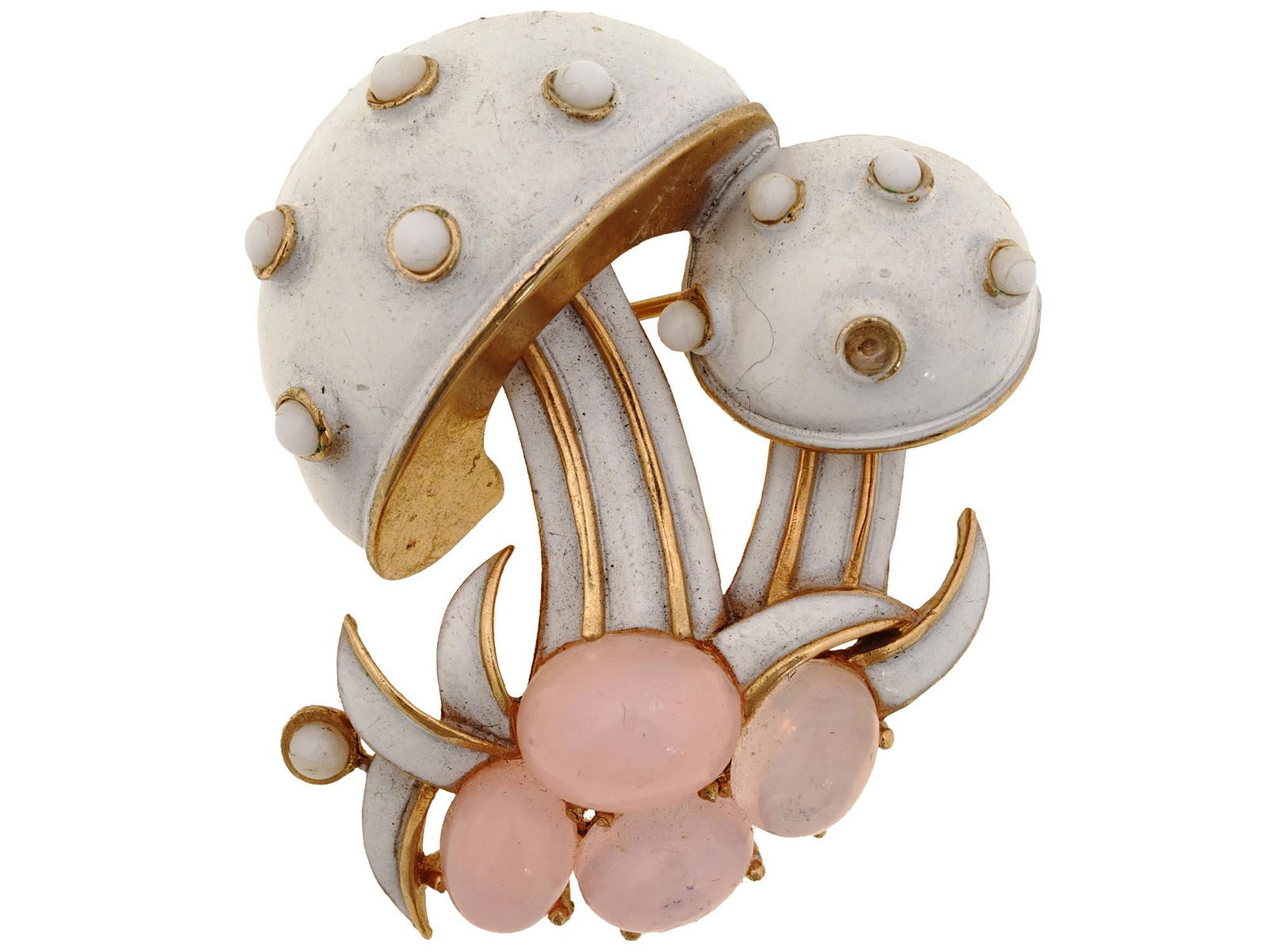 MIDCENT JEWELED GOLDEN MUSHROOM BROOCH BY TRIFARI: A 1960s golden mushroom brooch by Trifari. The piece represents a pair of white and gold mushrooms with bead accents and and four pink cabochons on the base. Hallmark Trifari is on the backside. Colle