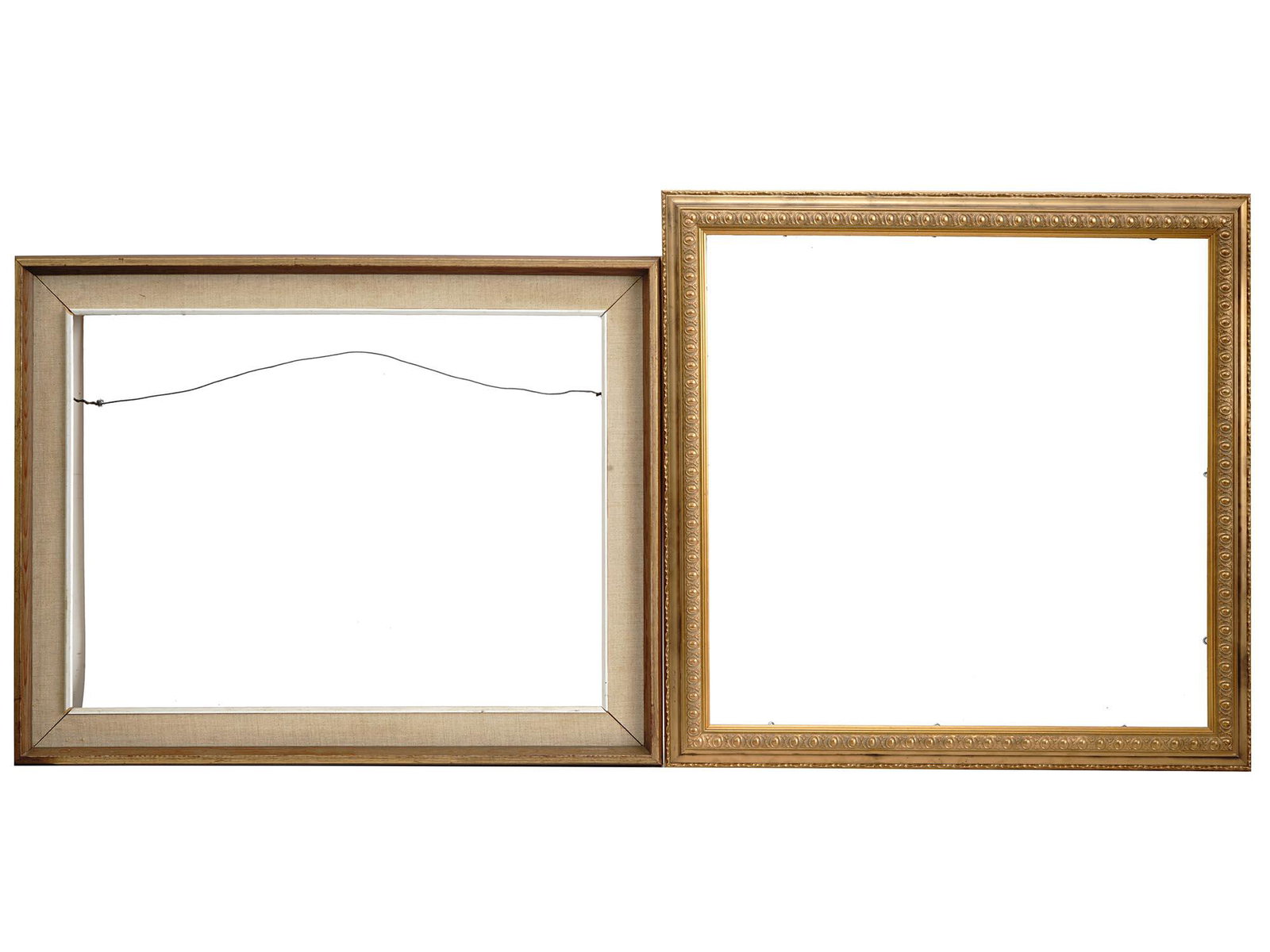 EUROPEAN SCHOOL CLASSIC PLEIN AIR WOODEN FRAMES: A pair of vintage European school gilt wooden frames. The first frame is made in a classic plein air design. The second frame is gilt wooden, adorned with a relief ornament. Circa: the first half of t