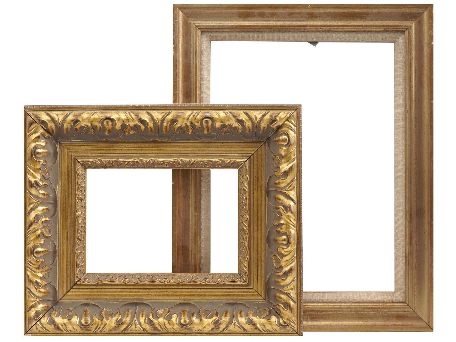ORNATE AND PLEIN AIR GILT WOODEN PICTURE FRAMES: A lot of two vintage picture frames. First. A gilt hand-carved wooden picture frame with bold floral decor and ornate golden slips. Second. A gilt wooden picture frame with scooped profile and canvas