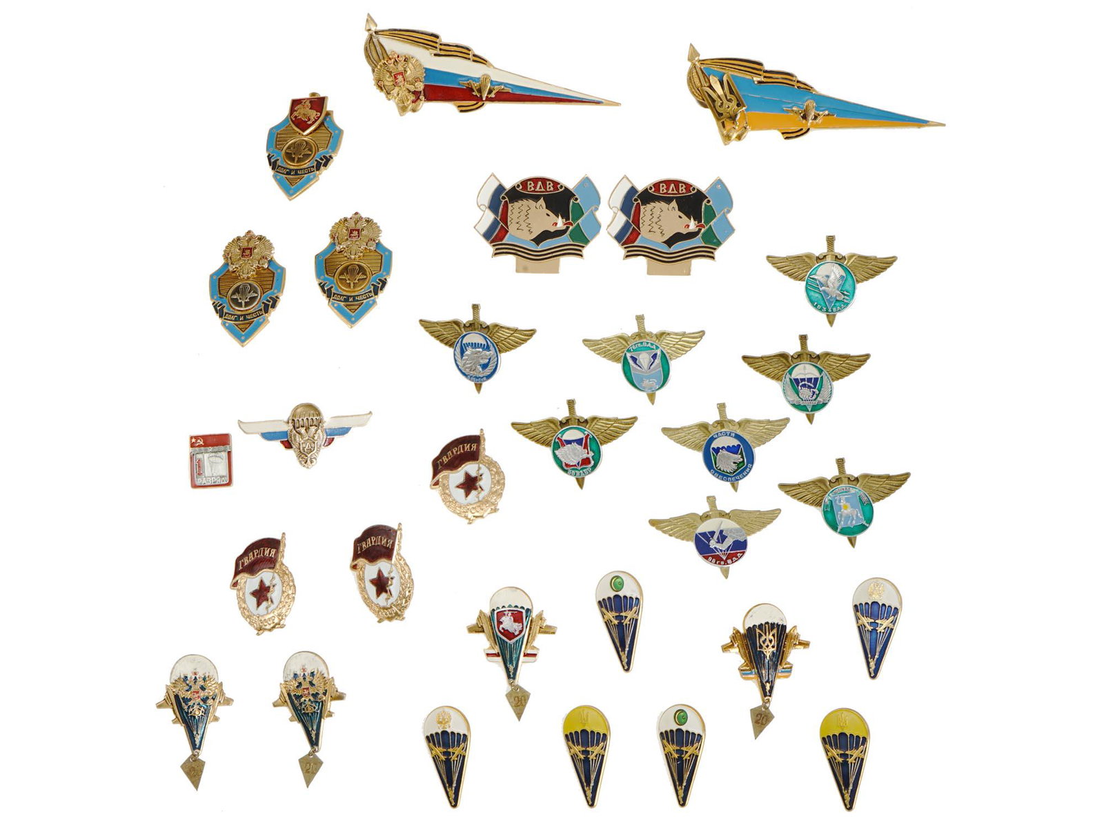 30 PCS OF RUSSIAN AND UKRAINIAN MILITARY BADGES: A set of 30 Russian and Ukrainian military badges including paratrooper badges, guard airborne assault division badges, army guard badges, excellence badges, air force beret badges, and more. Russian 