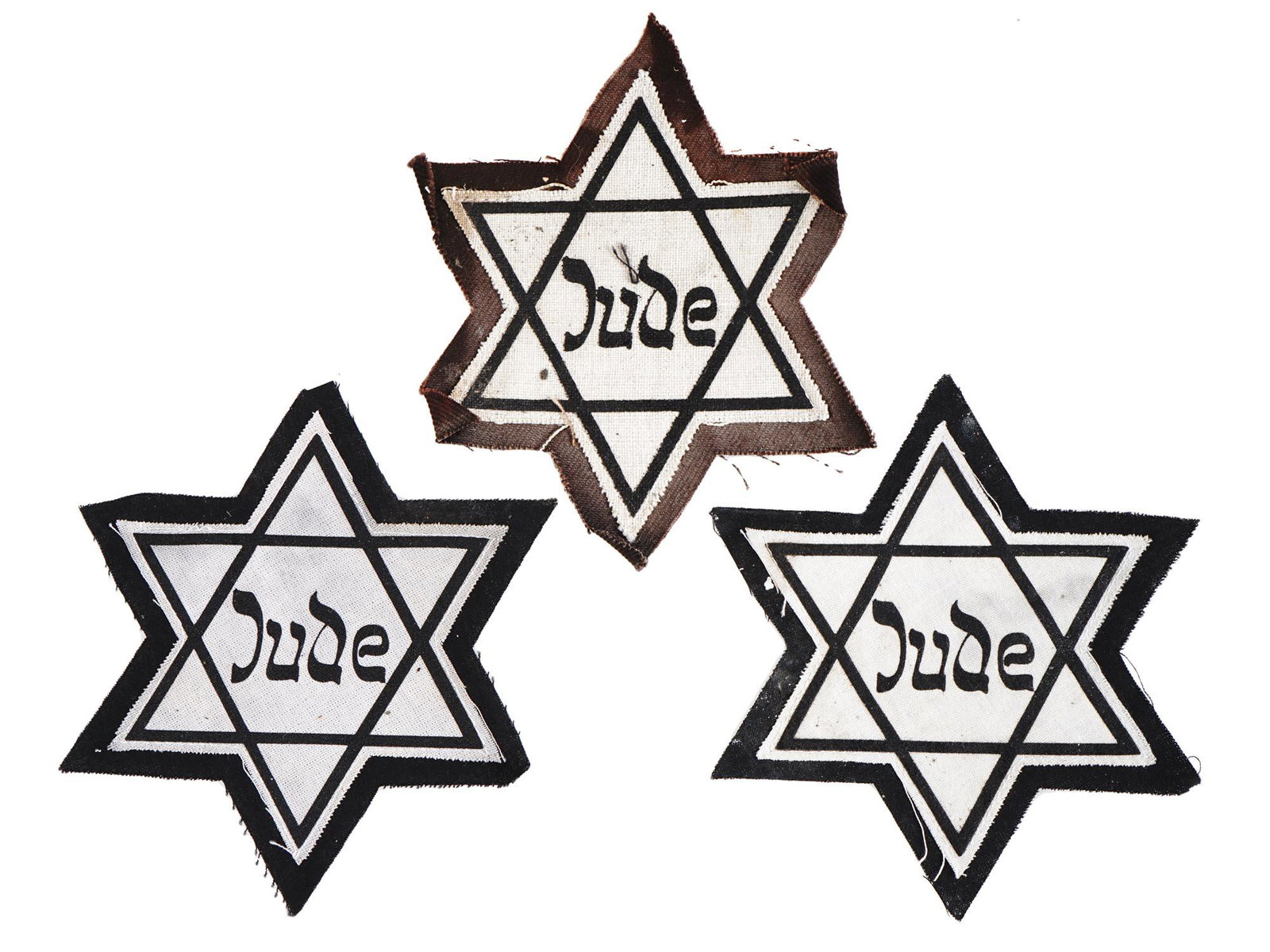 WWII HOLOCAUST JEWISH MAGEN DAVID JUDE ARMBANDS: A lot of three fabric ribands are shaped like the Star of David. The items have the inscription Jude in German. During World War II Jewish people living in Germany or in occupied territories were forc